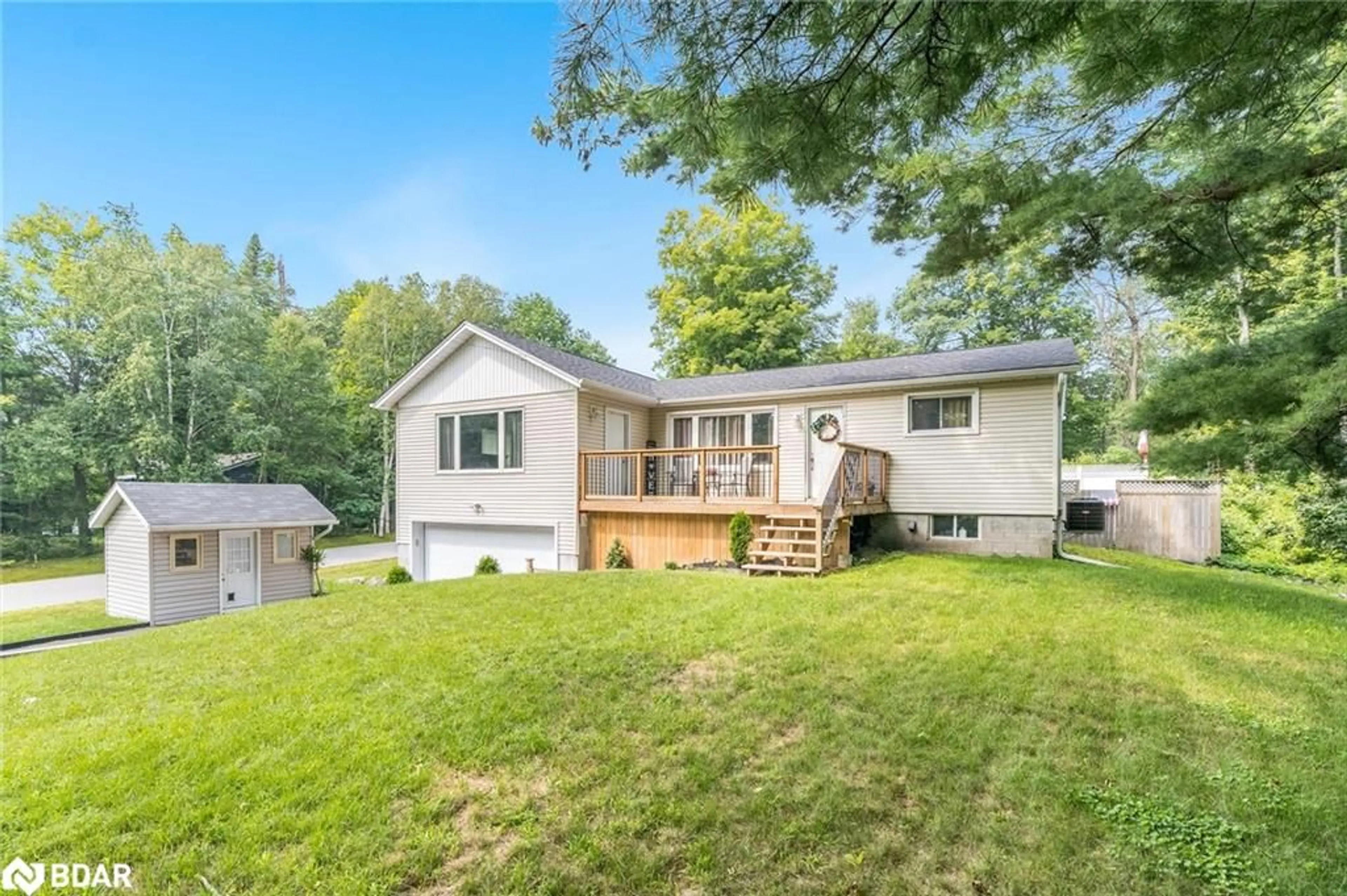 Frontside or backside of a home, the fenced backyard for 328 Peek-A-Boo Trail, Tiny Ontario L9M 0B3