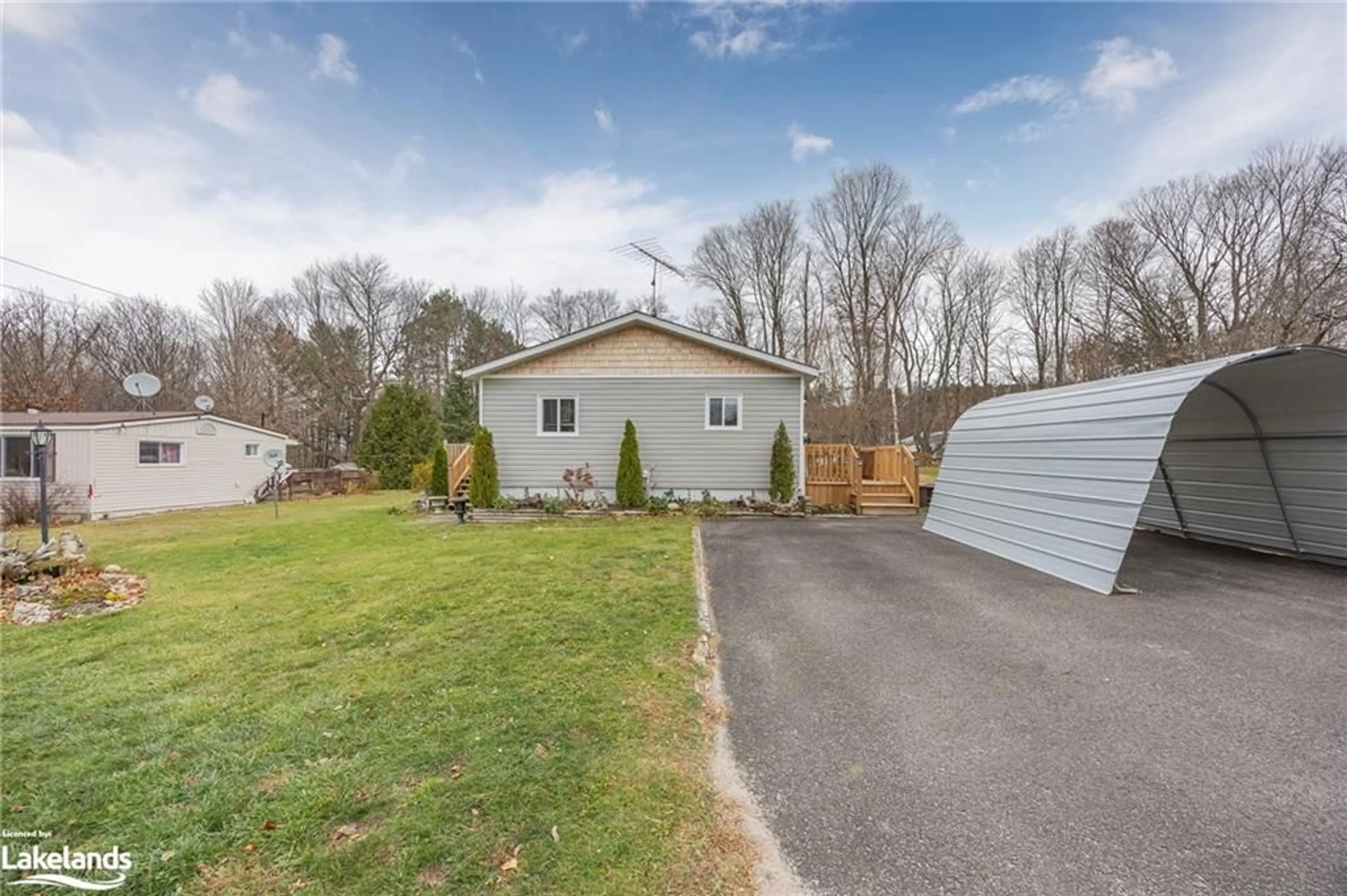 Frontside or backside of a home, the fenced backyard for 5263 Elliott Side Road #14, Tay Ontario L0K 1R0