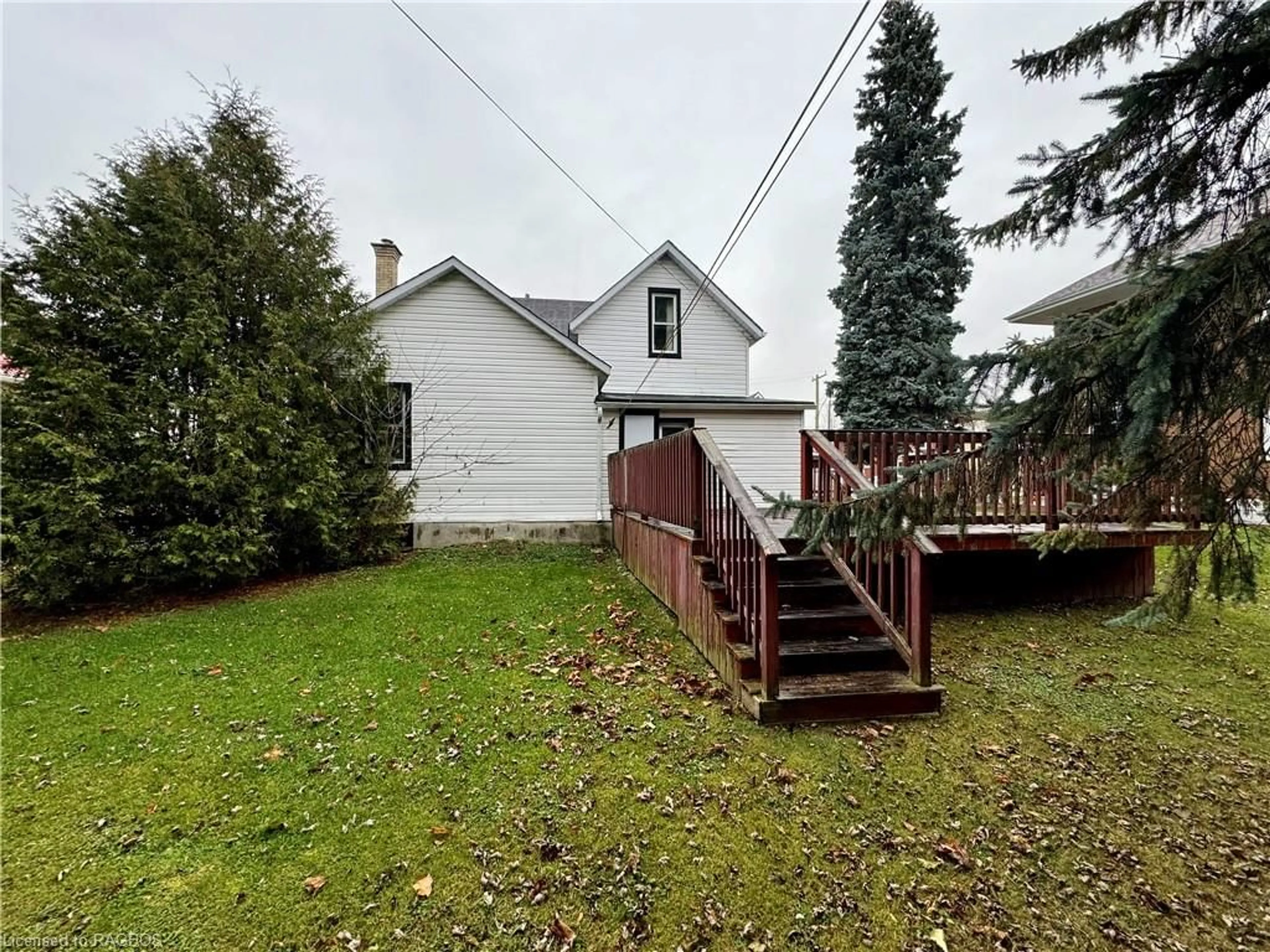 Frontside or backside of a home, the fenced backyard for 41 Elora St S, Mildmay Ontario N0G 2K0