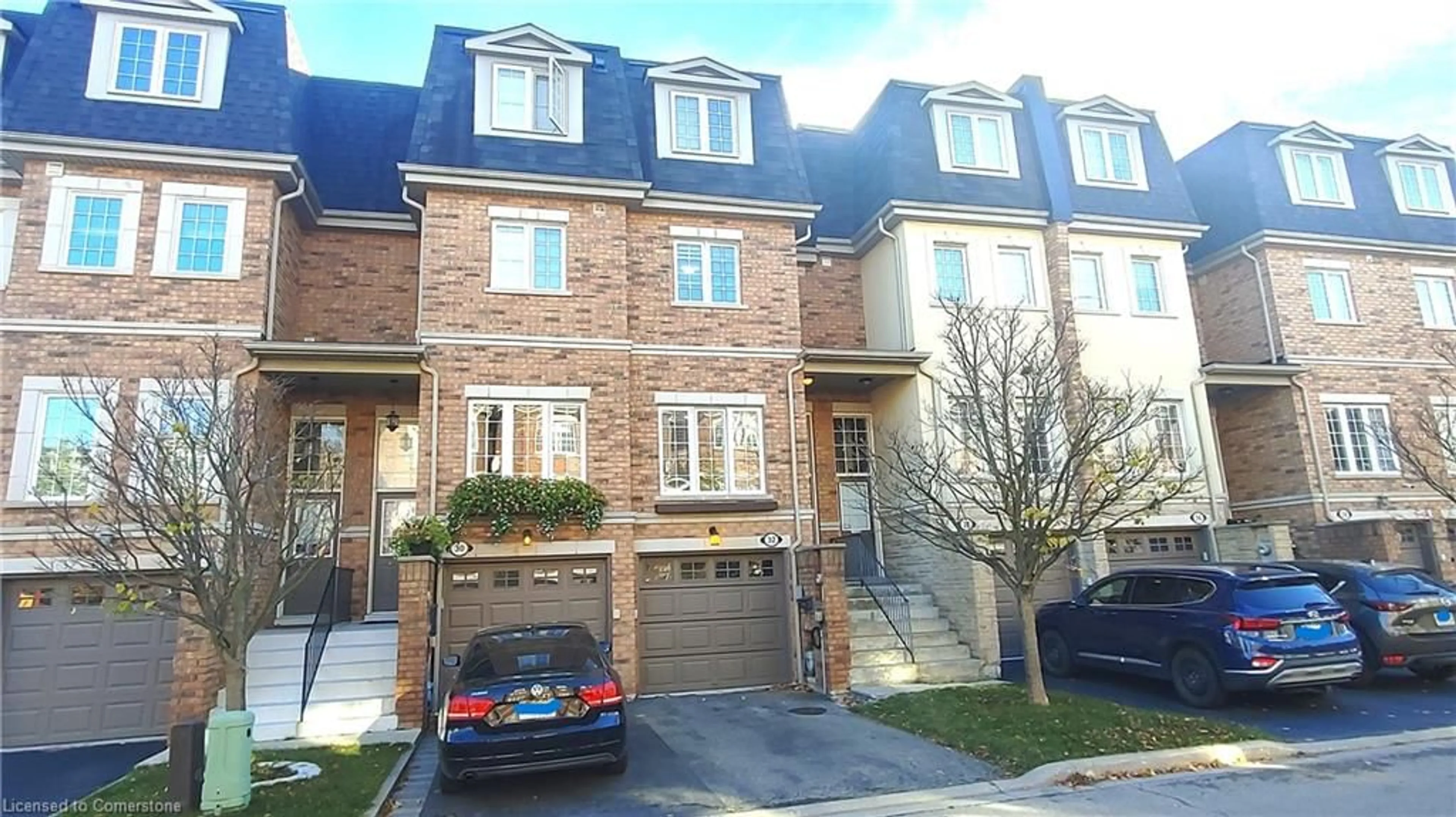 A pic from exterior of the house or condo, the street view for 435 Hensall Cir #32, Mississauga Ontario L5A 4P1