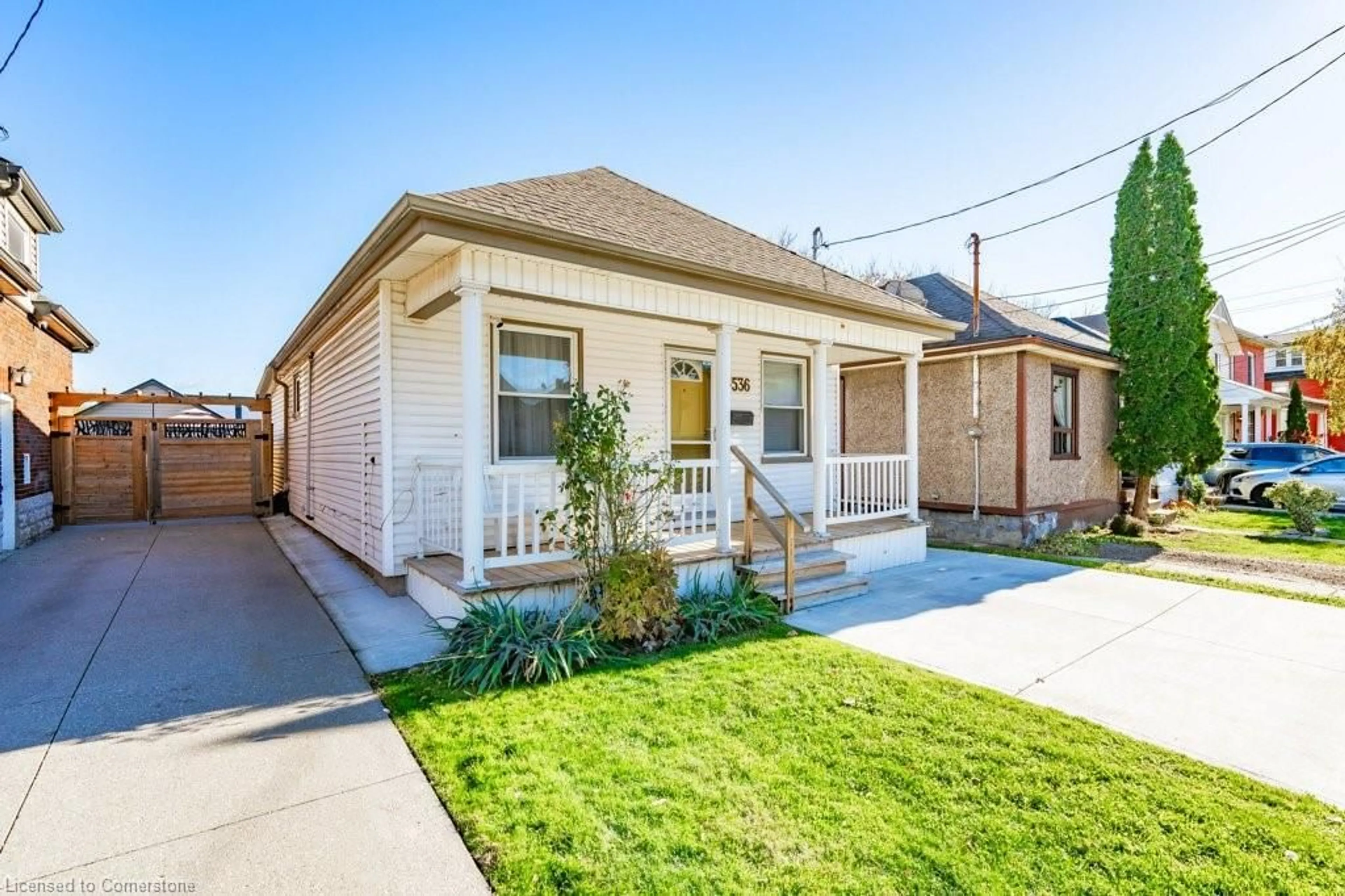 Frontside or backside of a home, the fenced backyard for 536 John St, Hamilton Ontario L8L 4S1