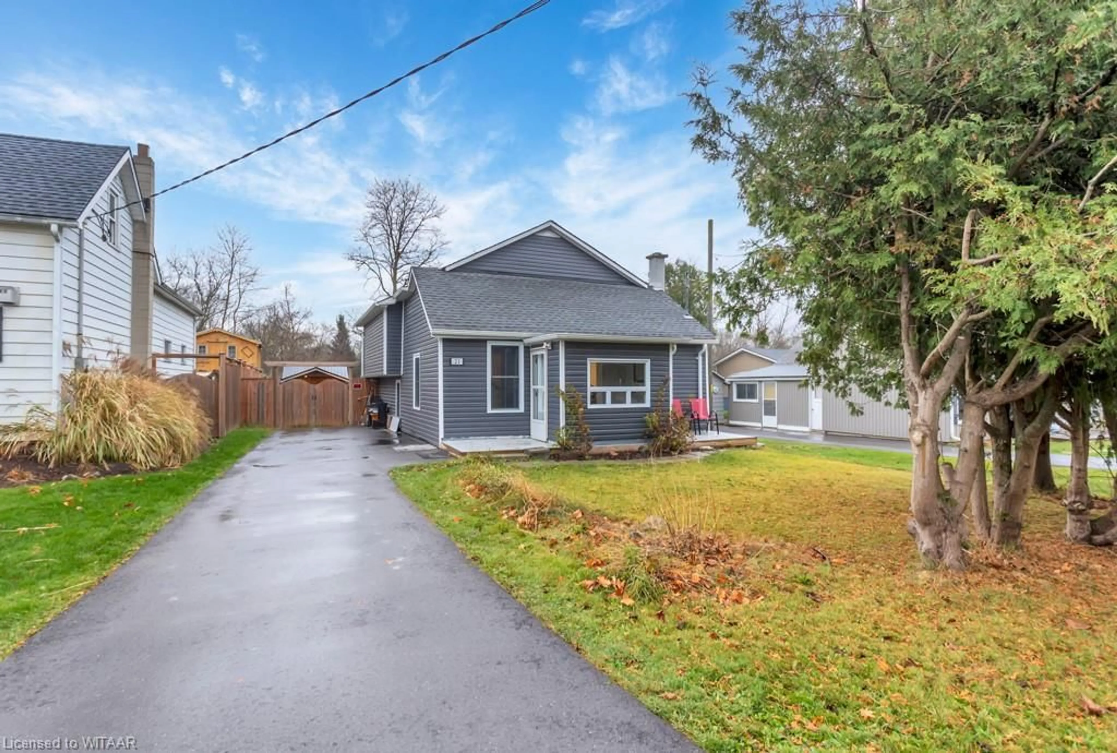 Frontside or backside of a home, the fenced backyard for 21 Oxford St, Beachville Ontario N0J 1A0