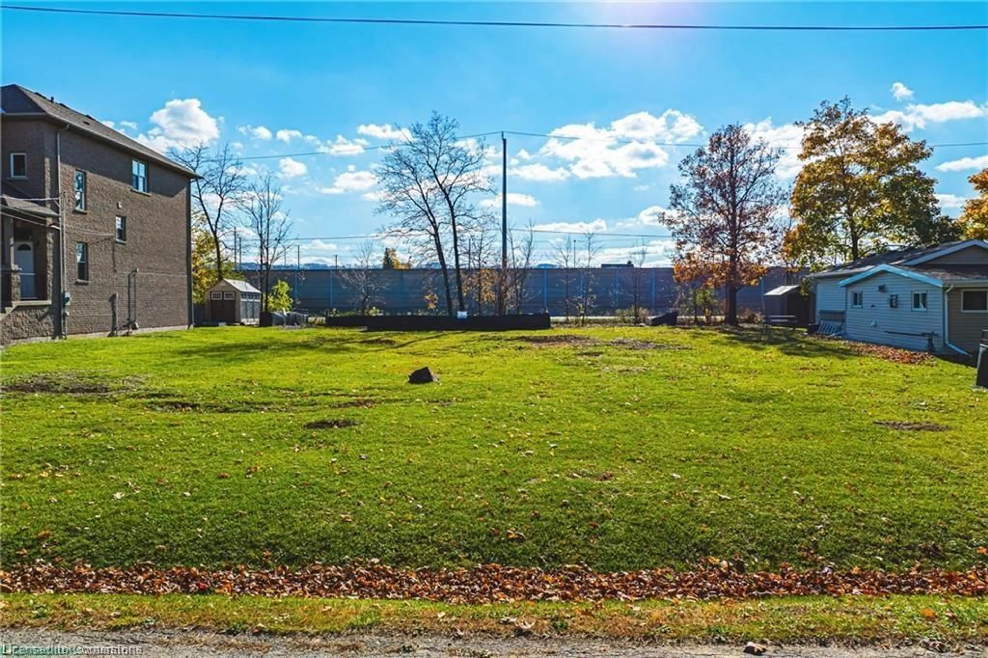 A pic from exterior of the house or condo, the fenced backyard for 5 Trillium Ave, Stoney Creek Ontario L8E 5E1