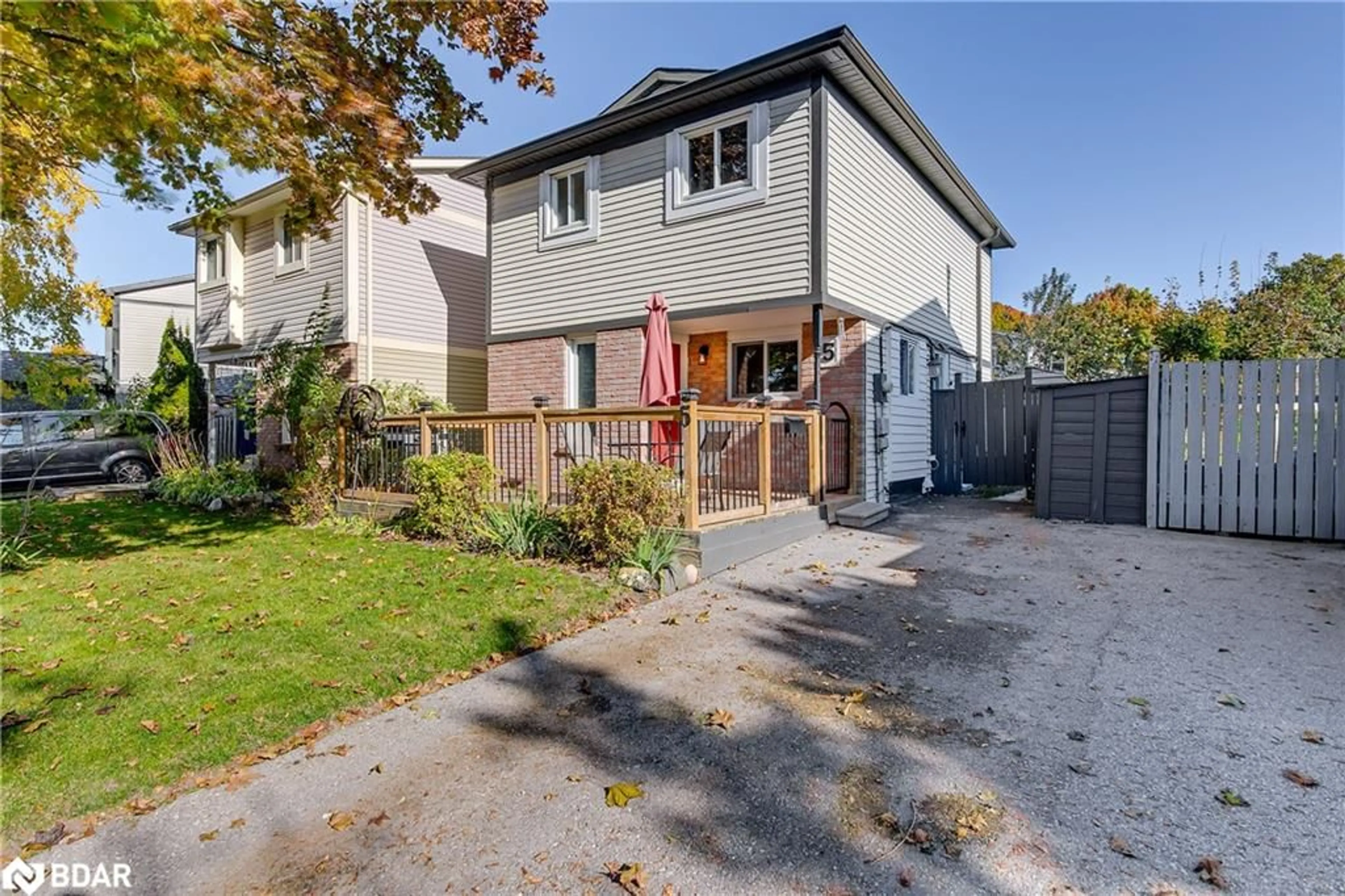 Frontside or backside of a home, the fenced backyard for 5 Dickens Dr, Barrie Ontario L4N 5C4