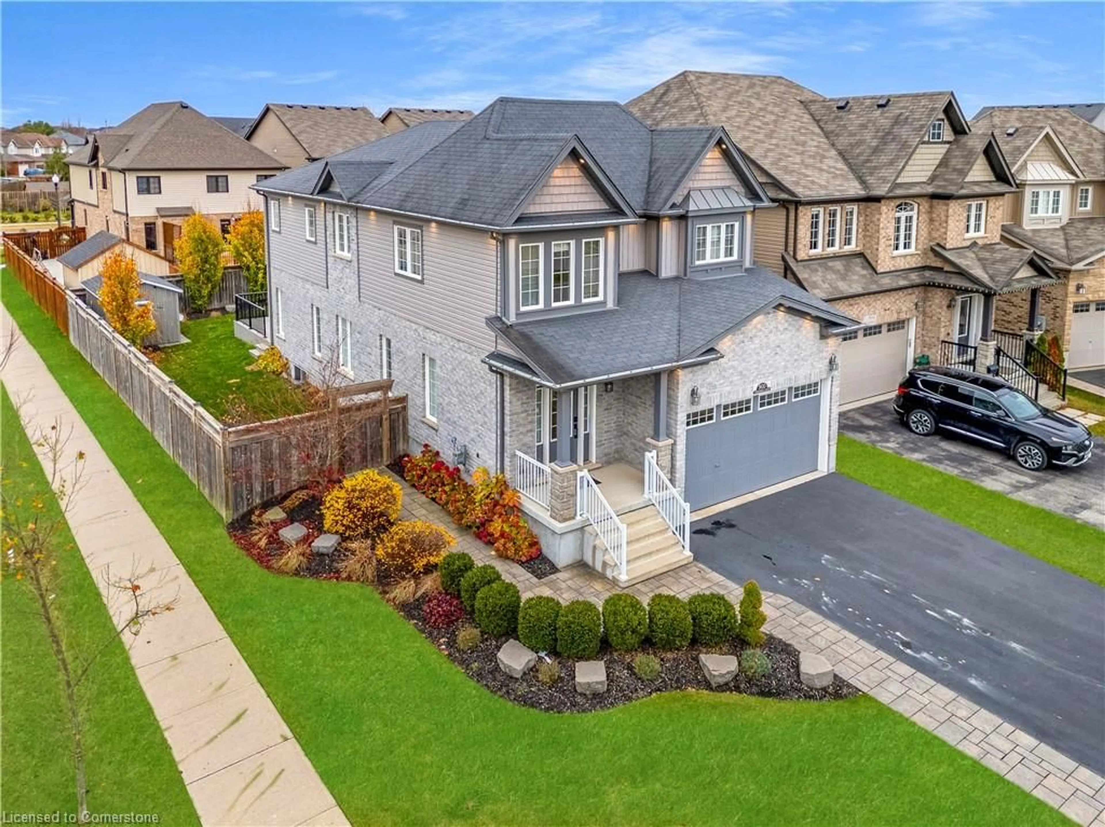 Frontside or backside of a home, the fenced backyard for 900 Steepleridge Crt, Kitchener Ontario N2P 0B4