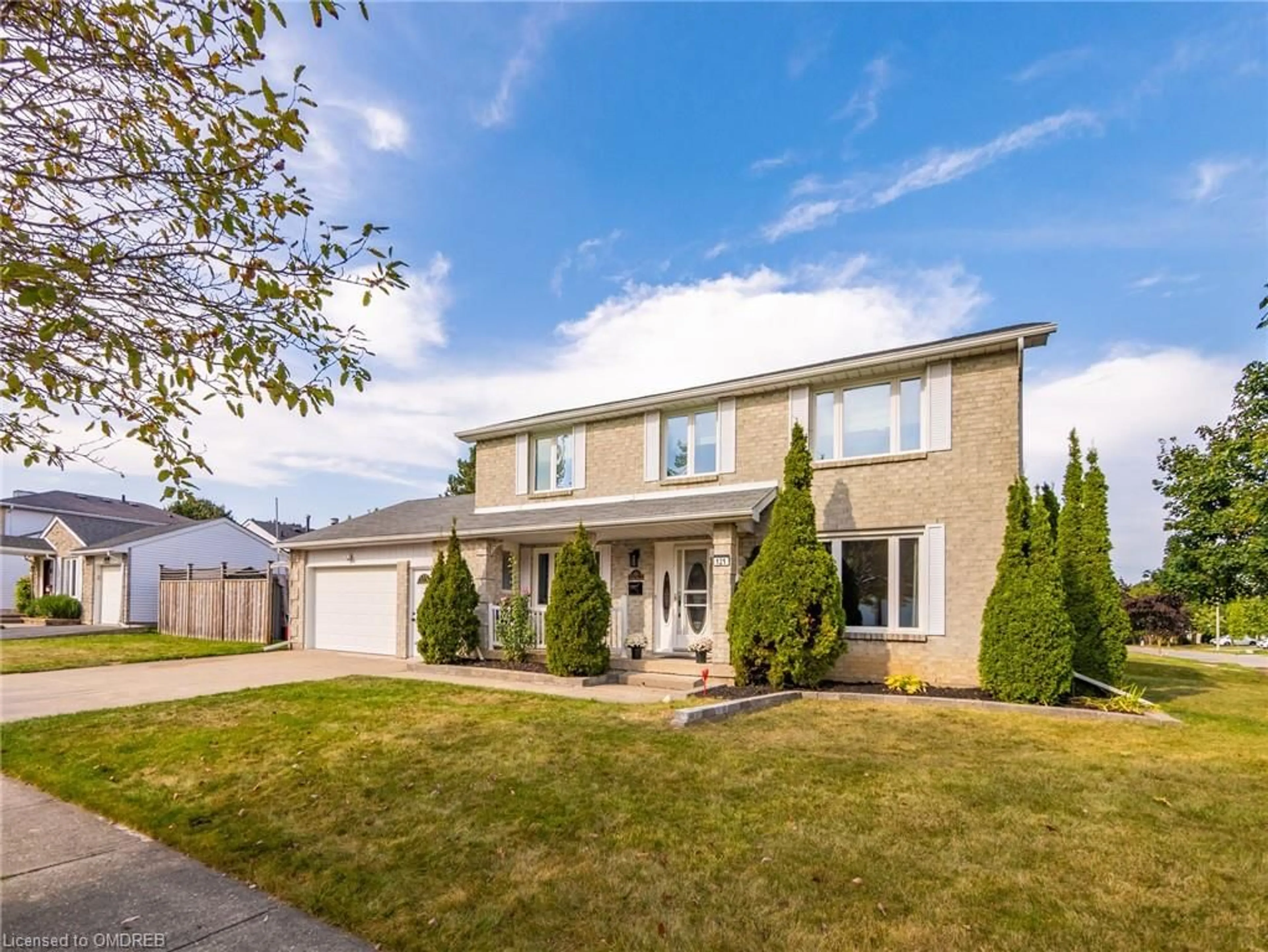 Frontside or backside of a home, the fenced backyard for 121 Parkland Cres, Kitchener Ontario N2N 1R5