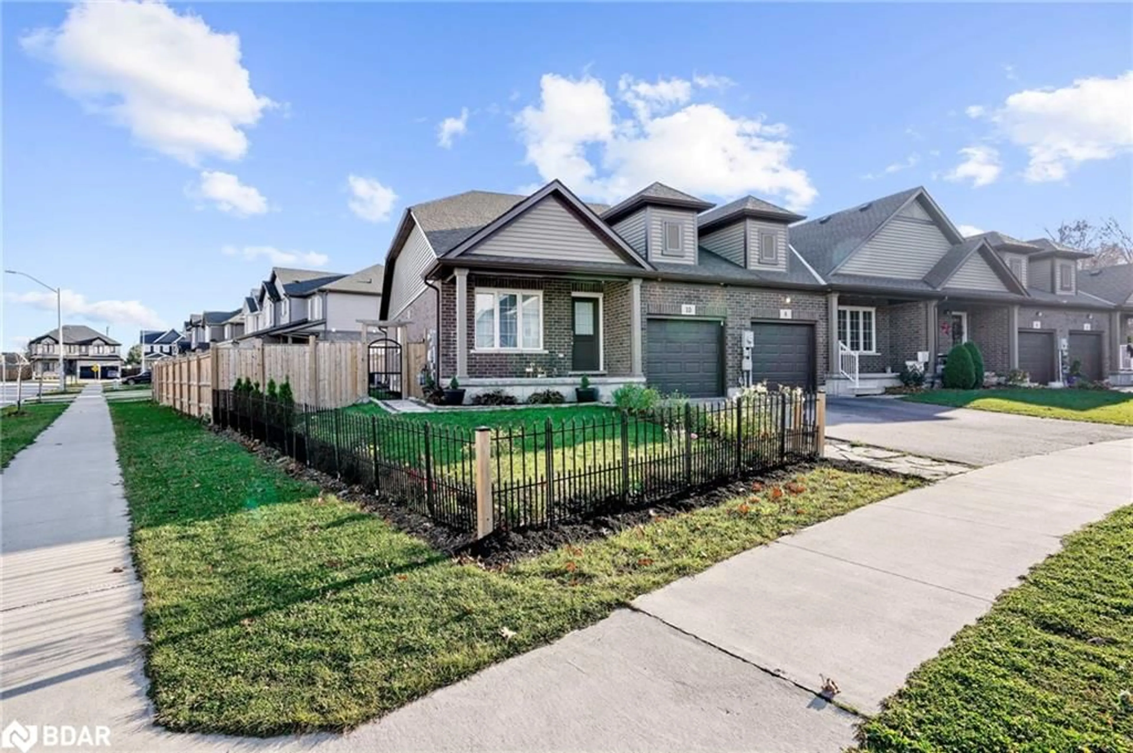 Frontside or backside of a home, the fenced backyard for 10 Hawthorn Ave, Thorold Ontario L2V 0J1