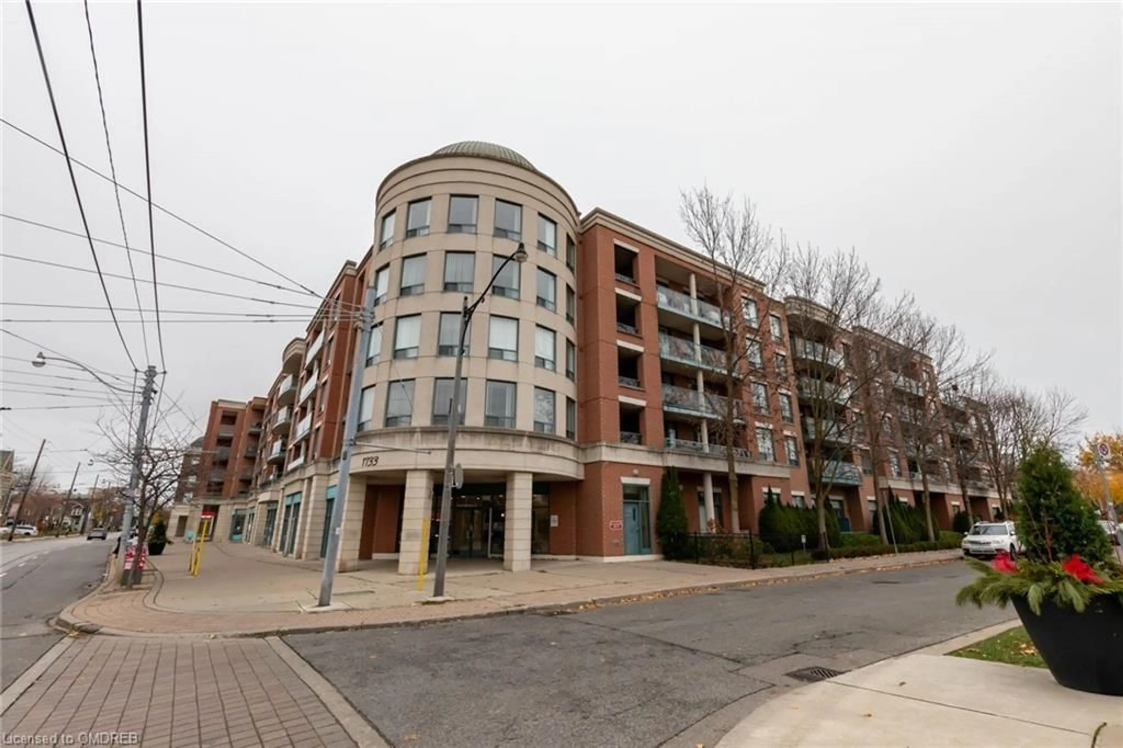 A pic from exterior of the house or condo, the street view for 1733 Queen St #404, Toronto Ontario M4L 6S9