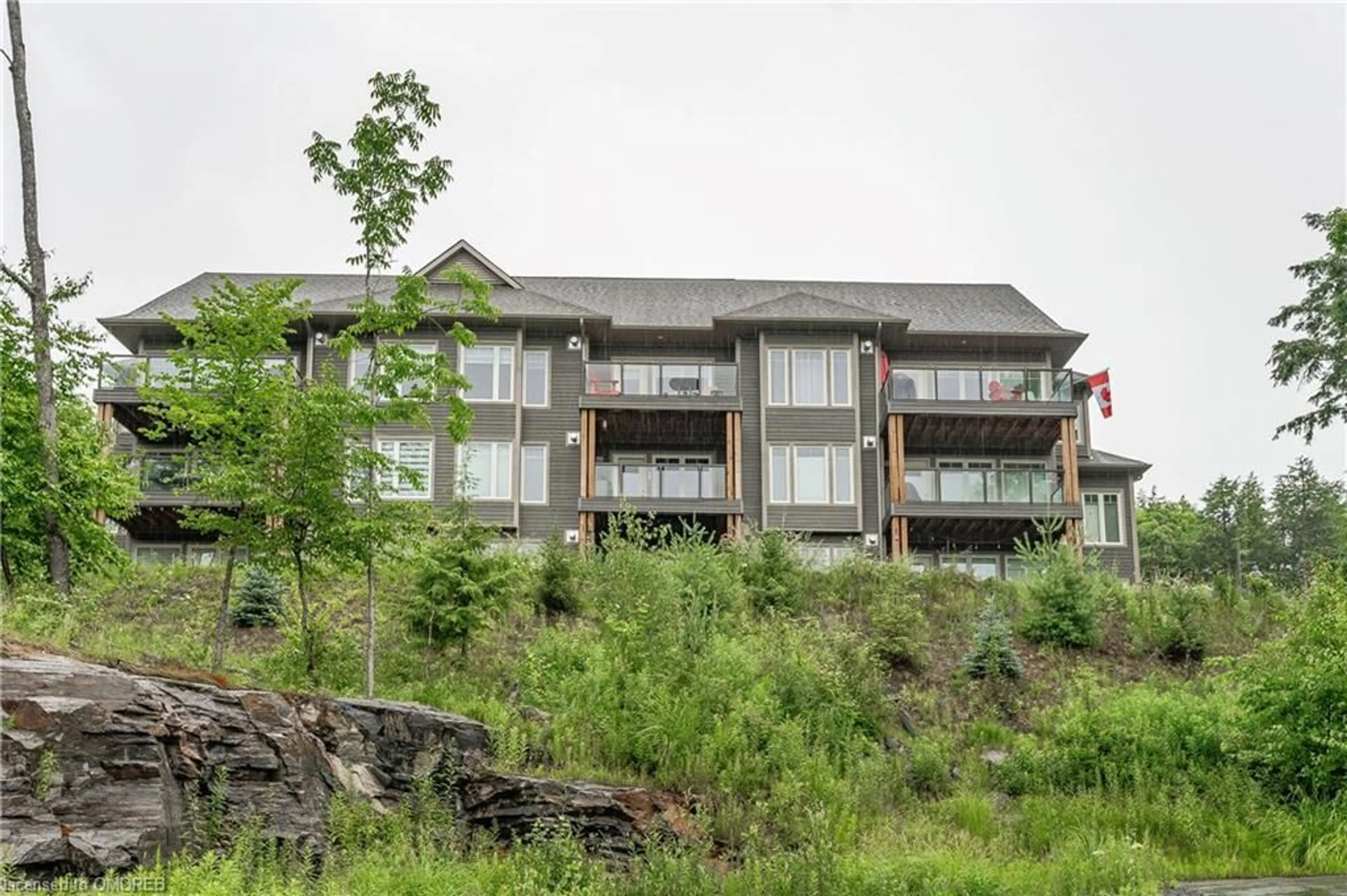 A pic from exterior of the house or condo, the front or back of building for 4 Tree Tops Lane #102, Huntsville Ontario P1H 0B8