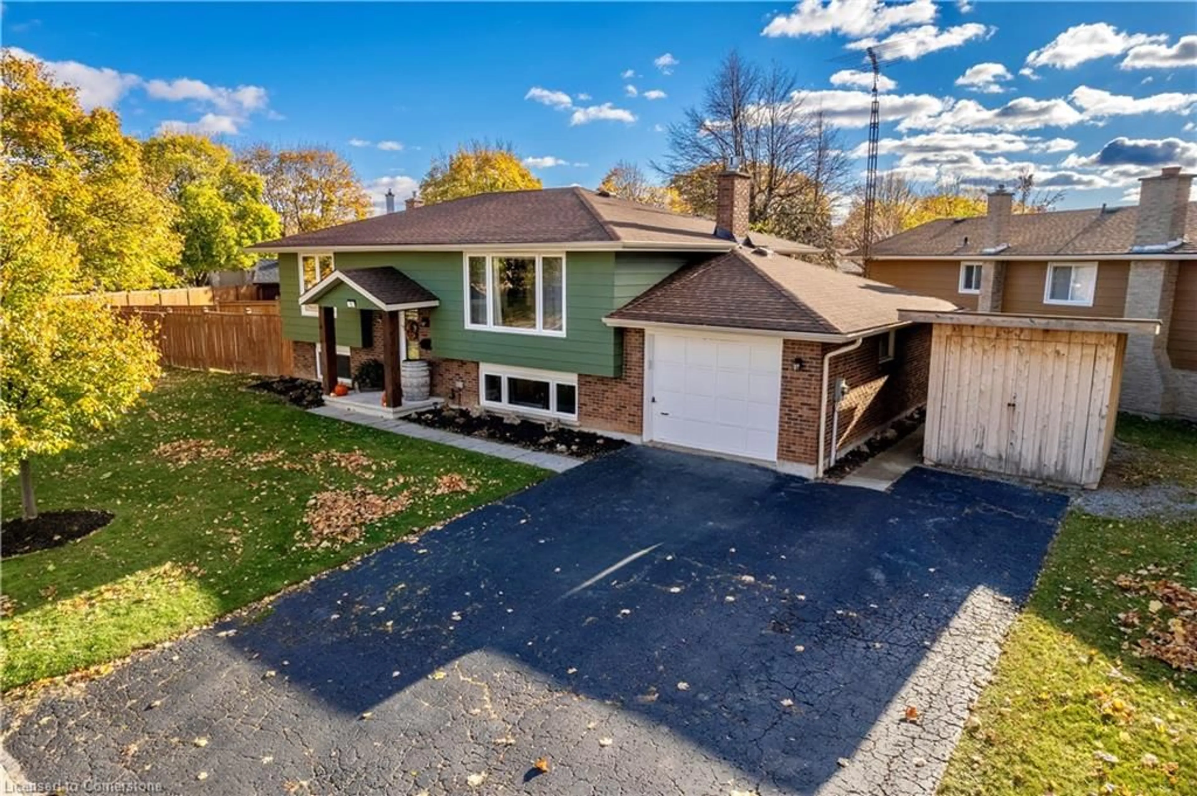 A pic from exterior of the house or condo, the fenced backyard for 12 Dwyer St, St. Catharines Ontario L2M 7G1