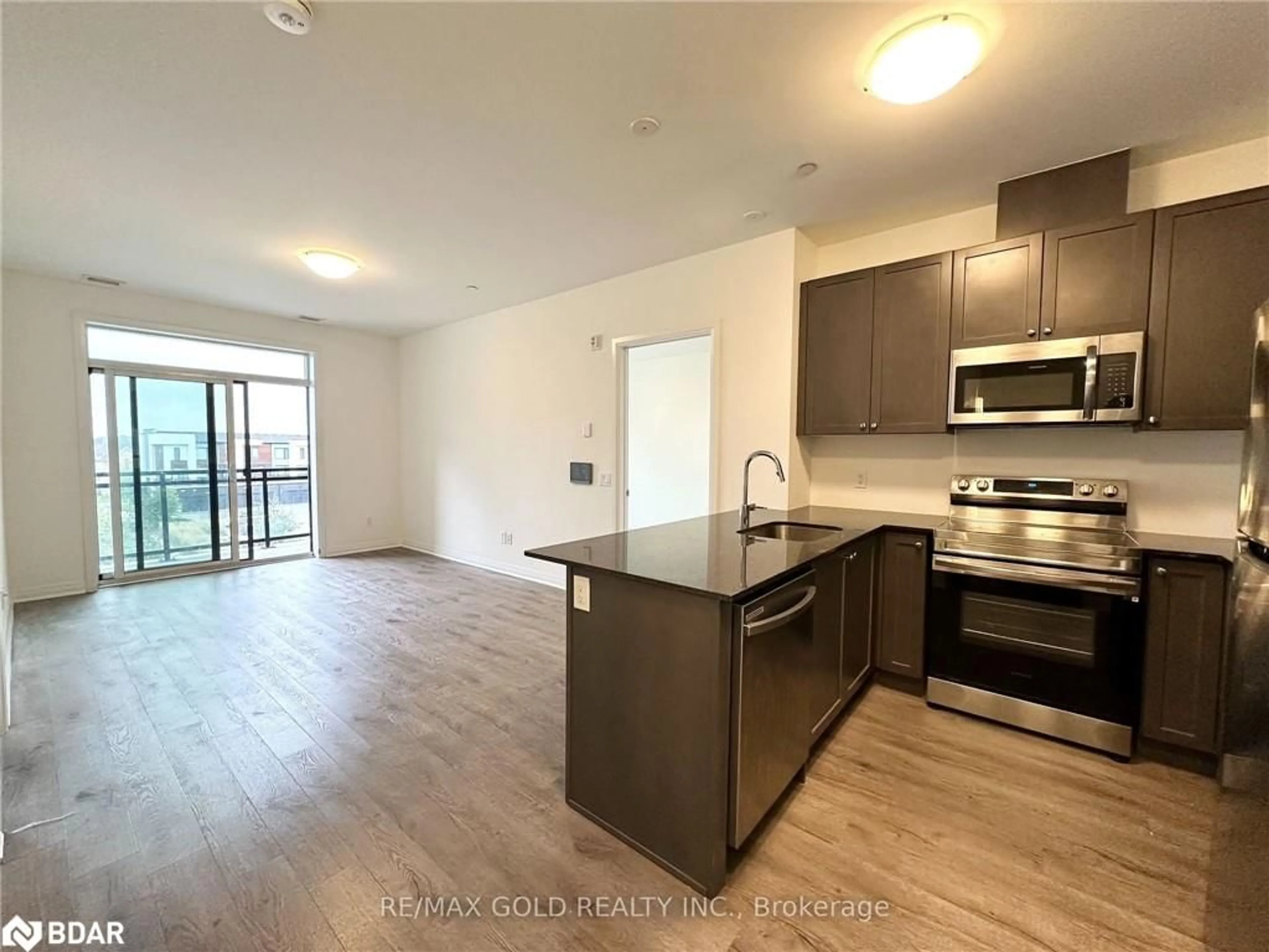 Standard kitchen, wood floors for 95 Dundas St #304, Oakville Ontario L6M 5N4