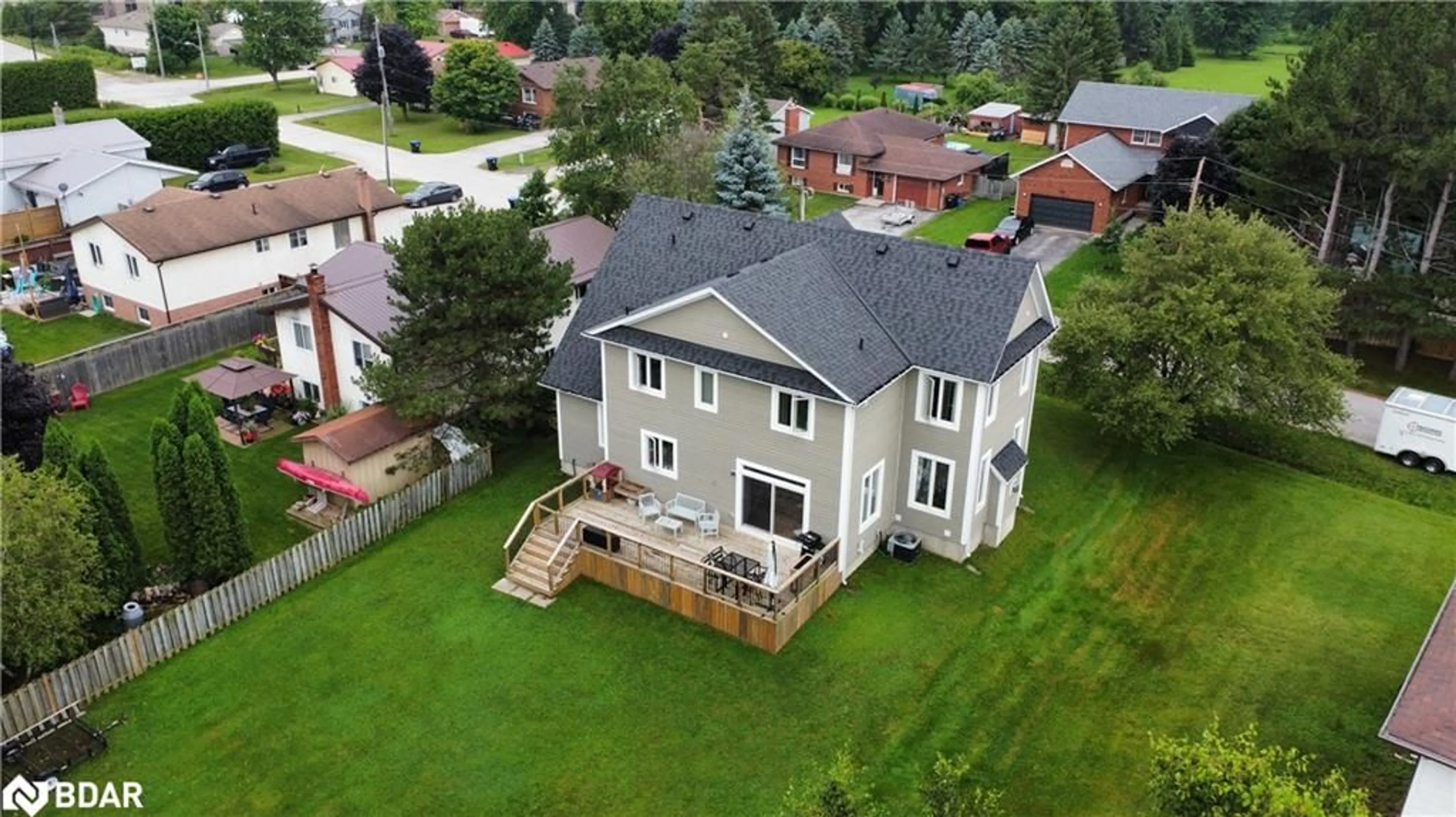 Frontside or backside of a home, the fenced backyard for 202 Clarence St, Stayner Ontario L0M 1S0