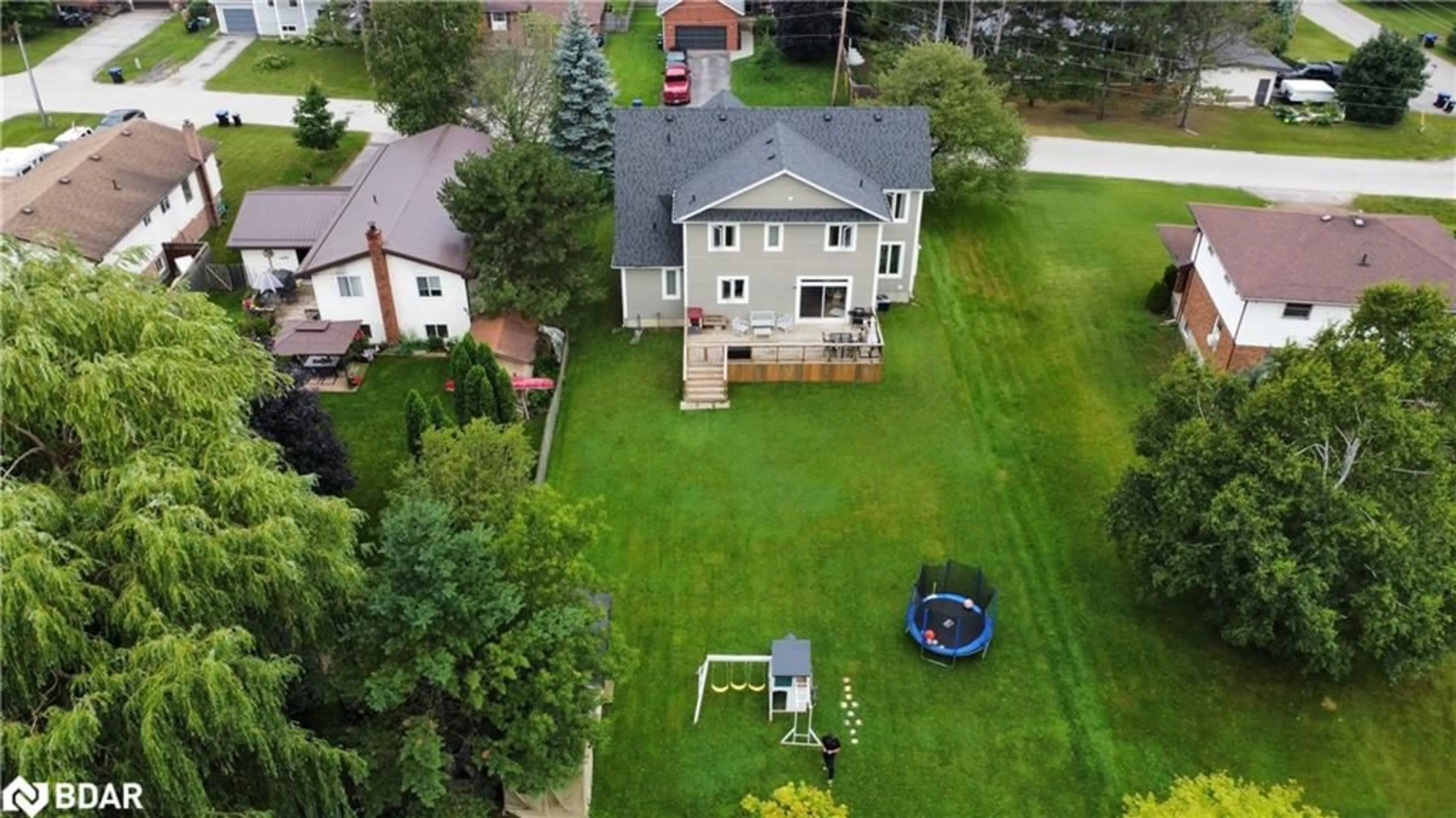 Frontside or backside of a home, the fenced backyard for 202 Clarence St, Stayner Ontario L0M 1S0