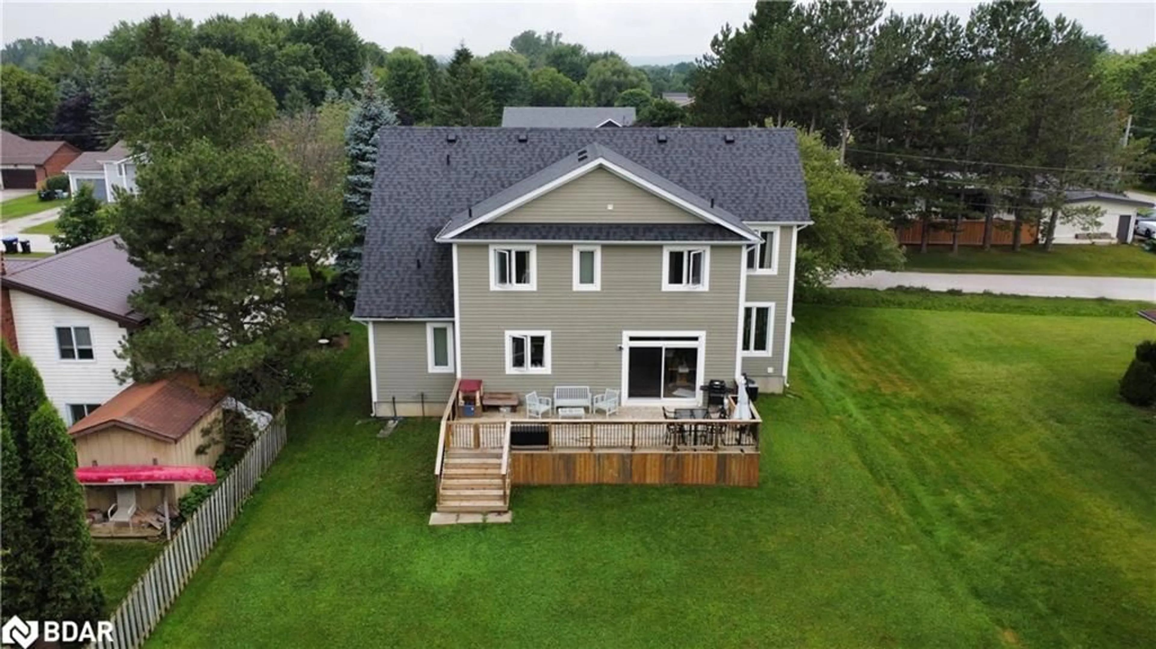 Frontside or backside of a home, the fenced backyard for 202 Clarence St, Stayner Ontario L0M 1S0