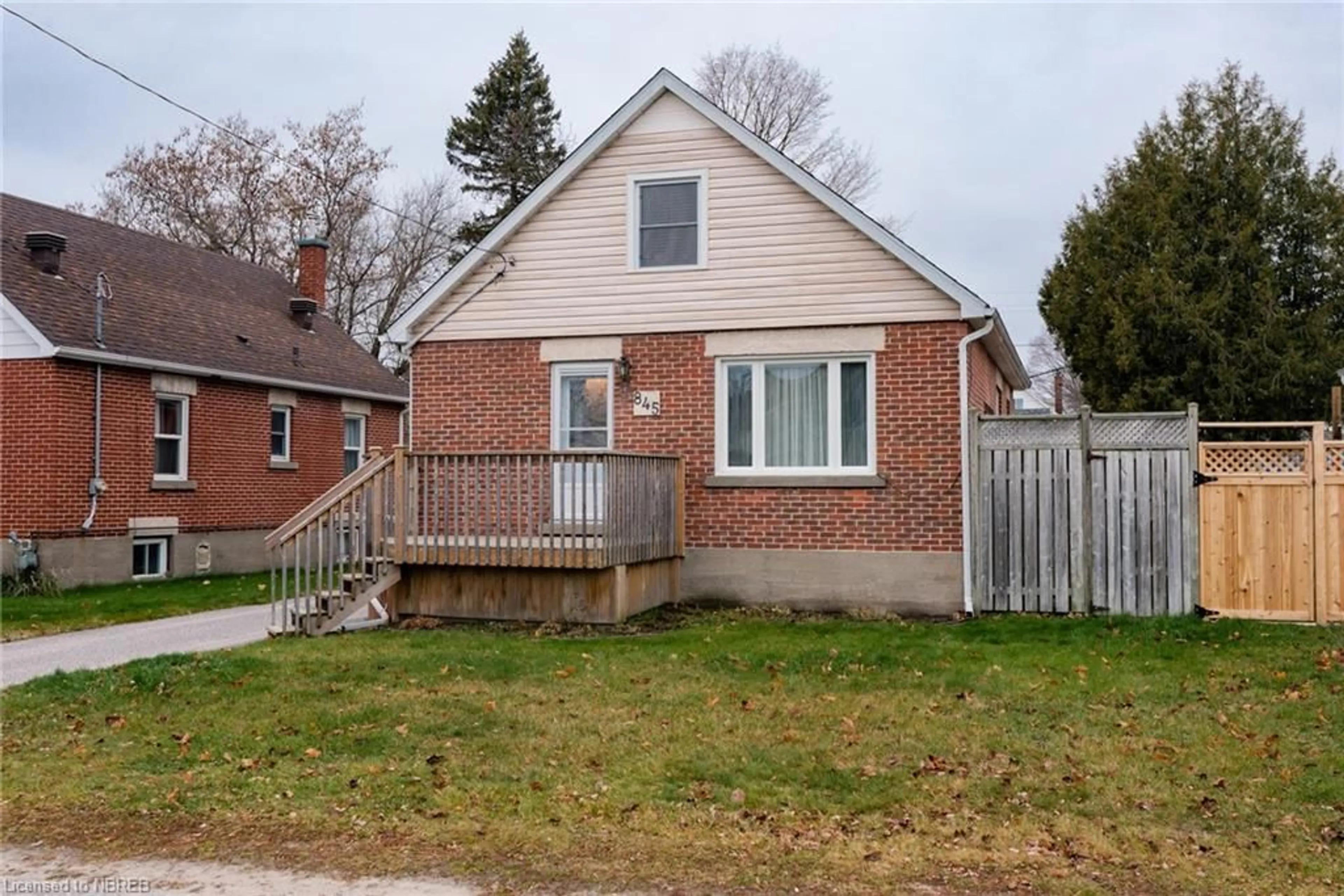 Frontside or backside of a home, the fenced backyard for 845 Ann St, North Bay Ontario P1B 5M2