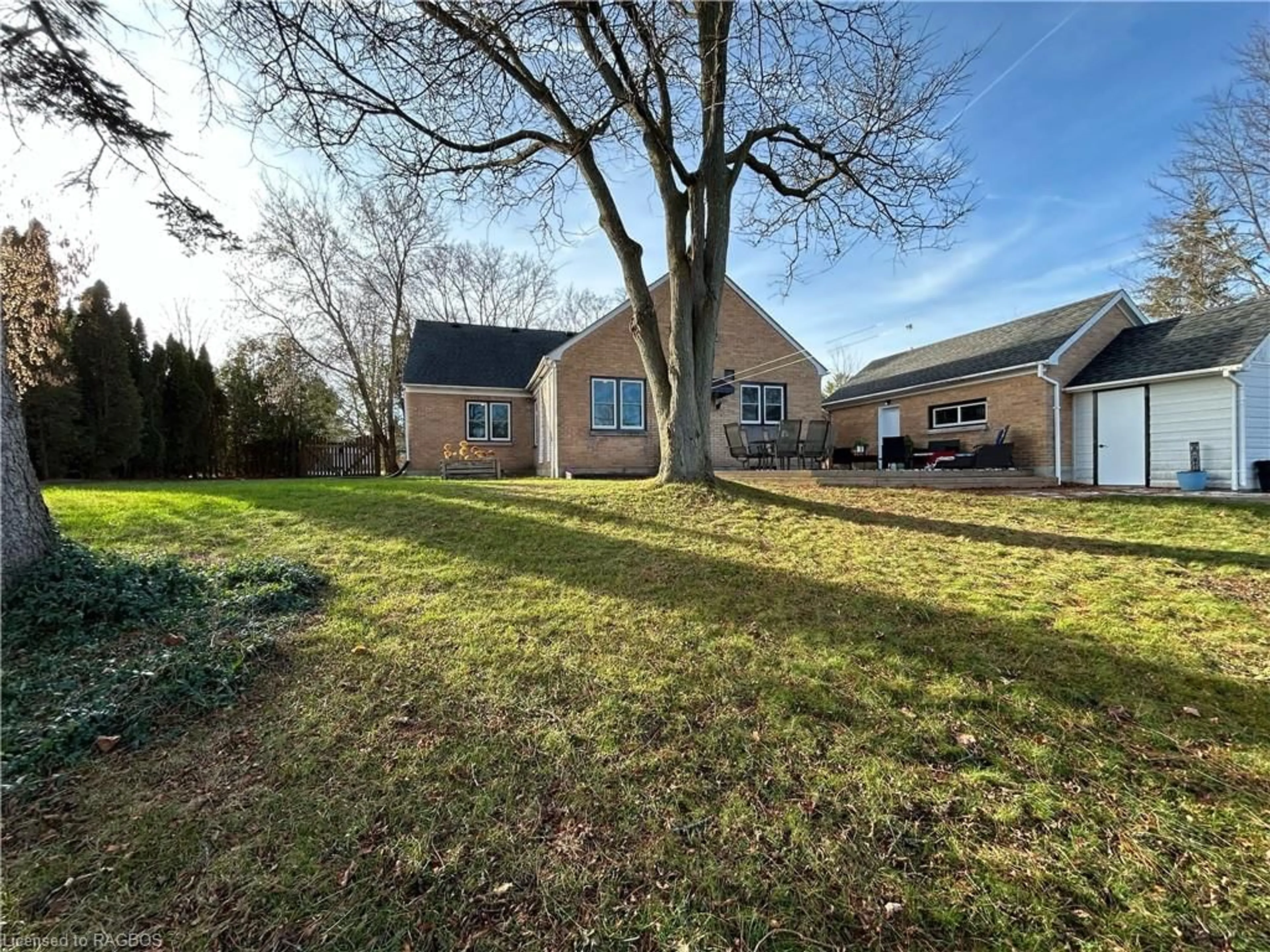 Frontside or backside of a home, the fenced backyard for 108 Hinks St, Walkerton Ontario N0G 2V0