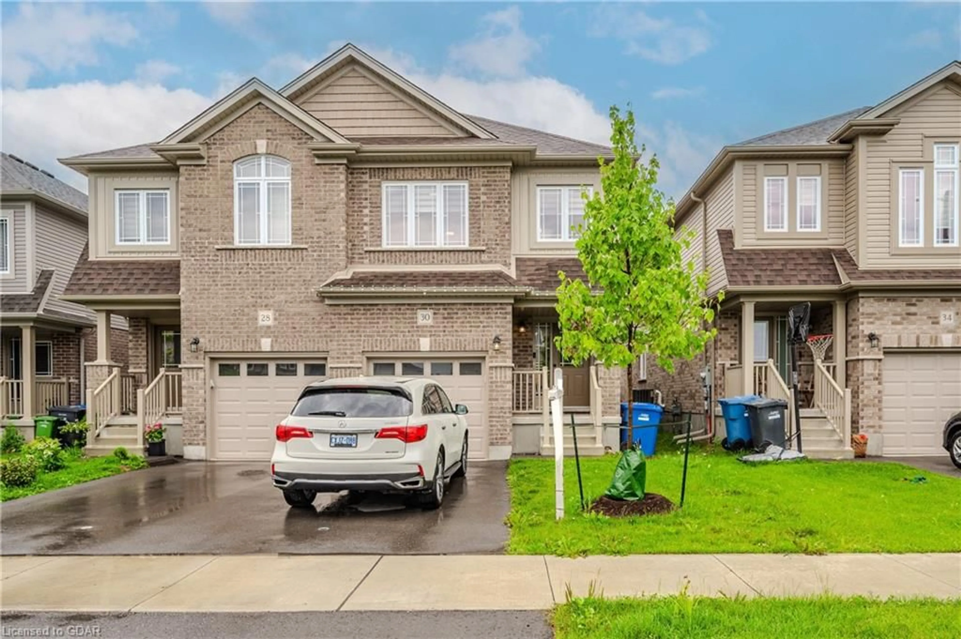 A pic from exterior of the house or condo, the street view for 30 John Brabson Cres, Guelph Ontario N1G 0G5