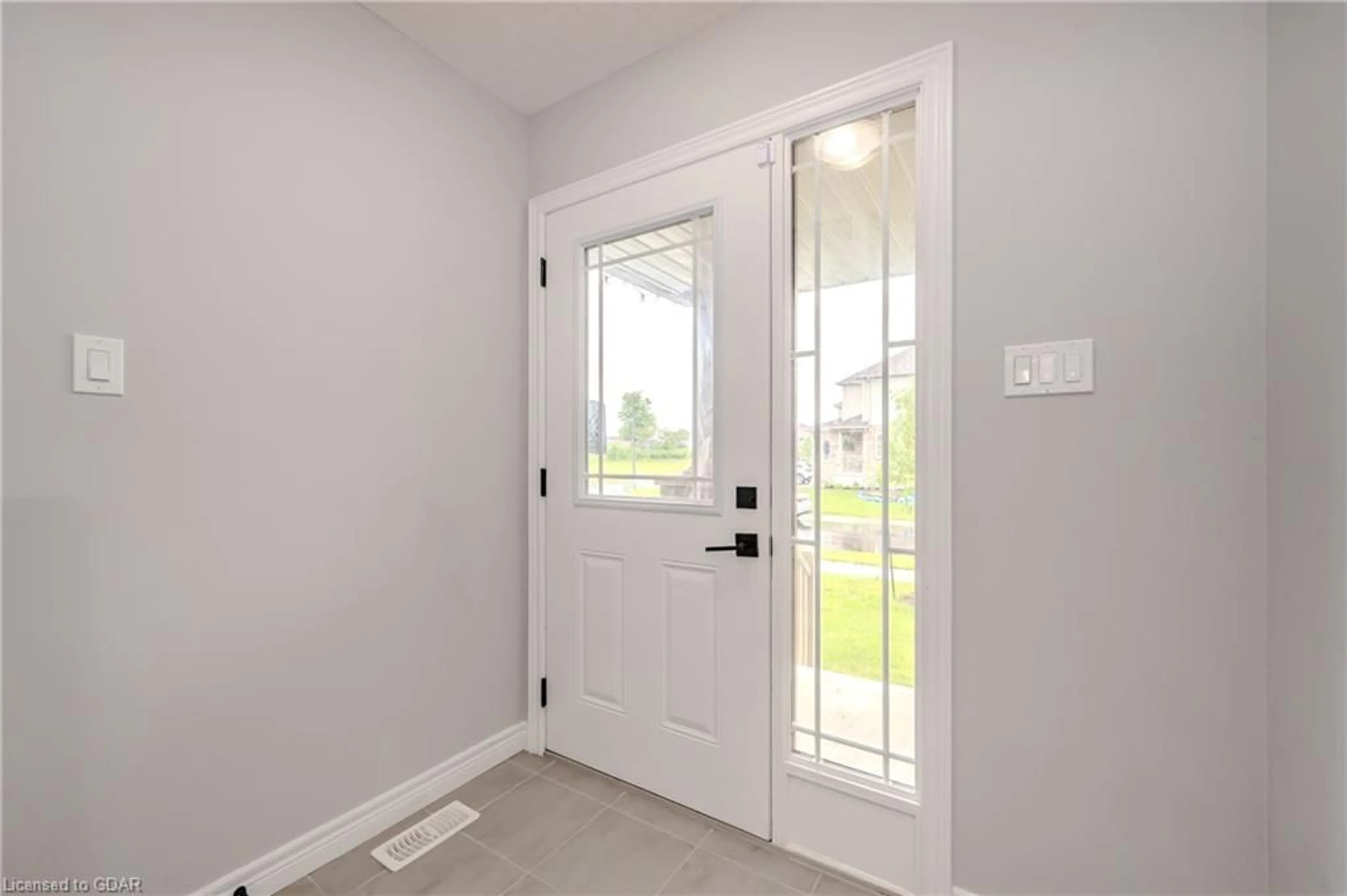 Indoor entryway, wood floors for 30 John Brabson Cres, Guelph Ontario N1G 0G5