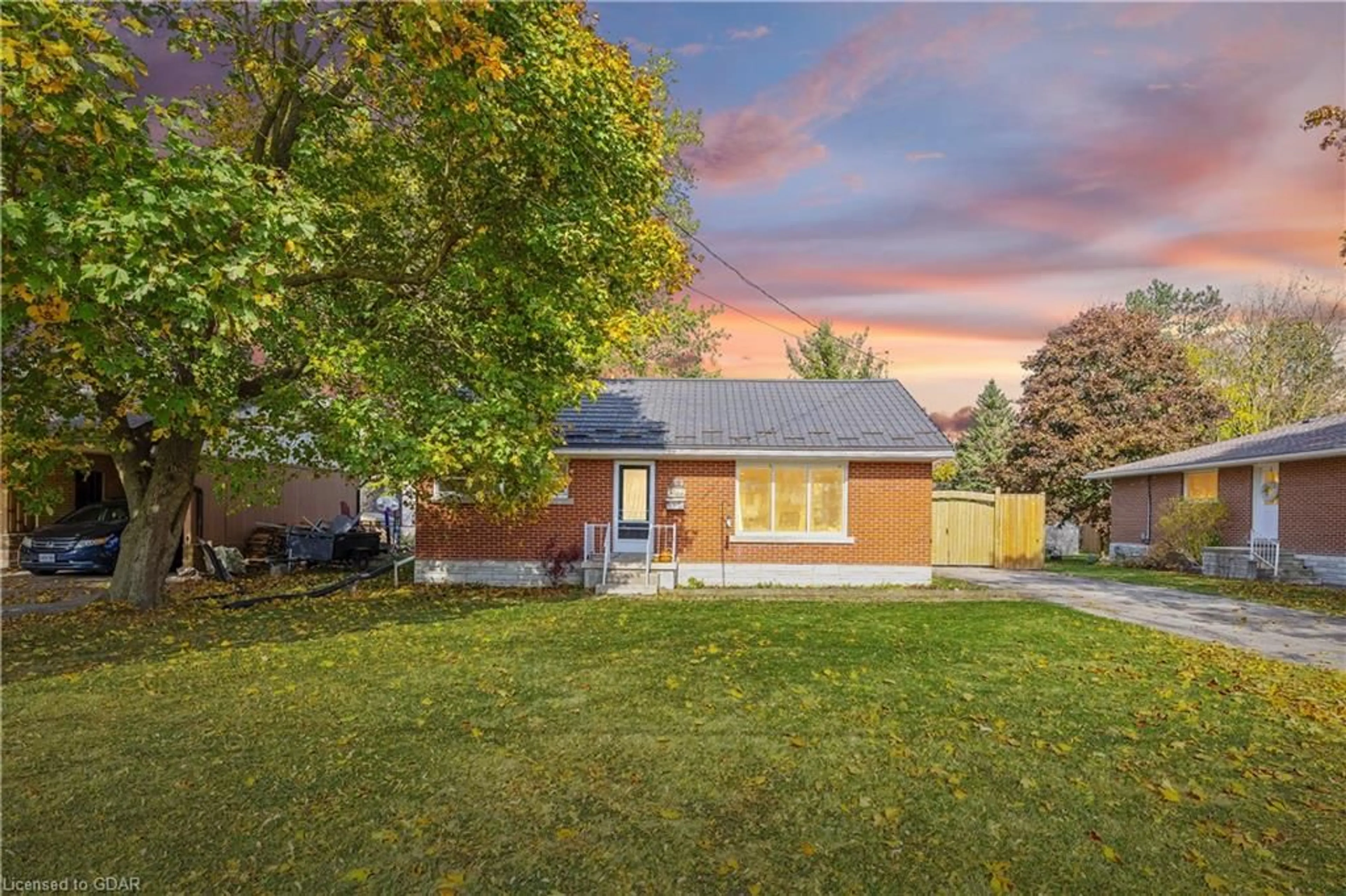 Frontside or backside of a home, the fenced backyard for 342 Smith Street, Arthur Ontario N0G 1A0