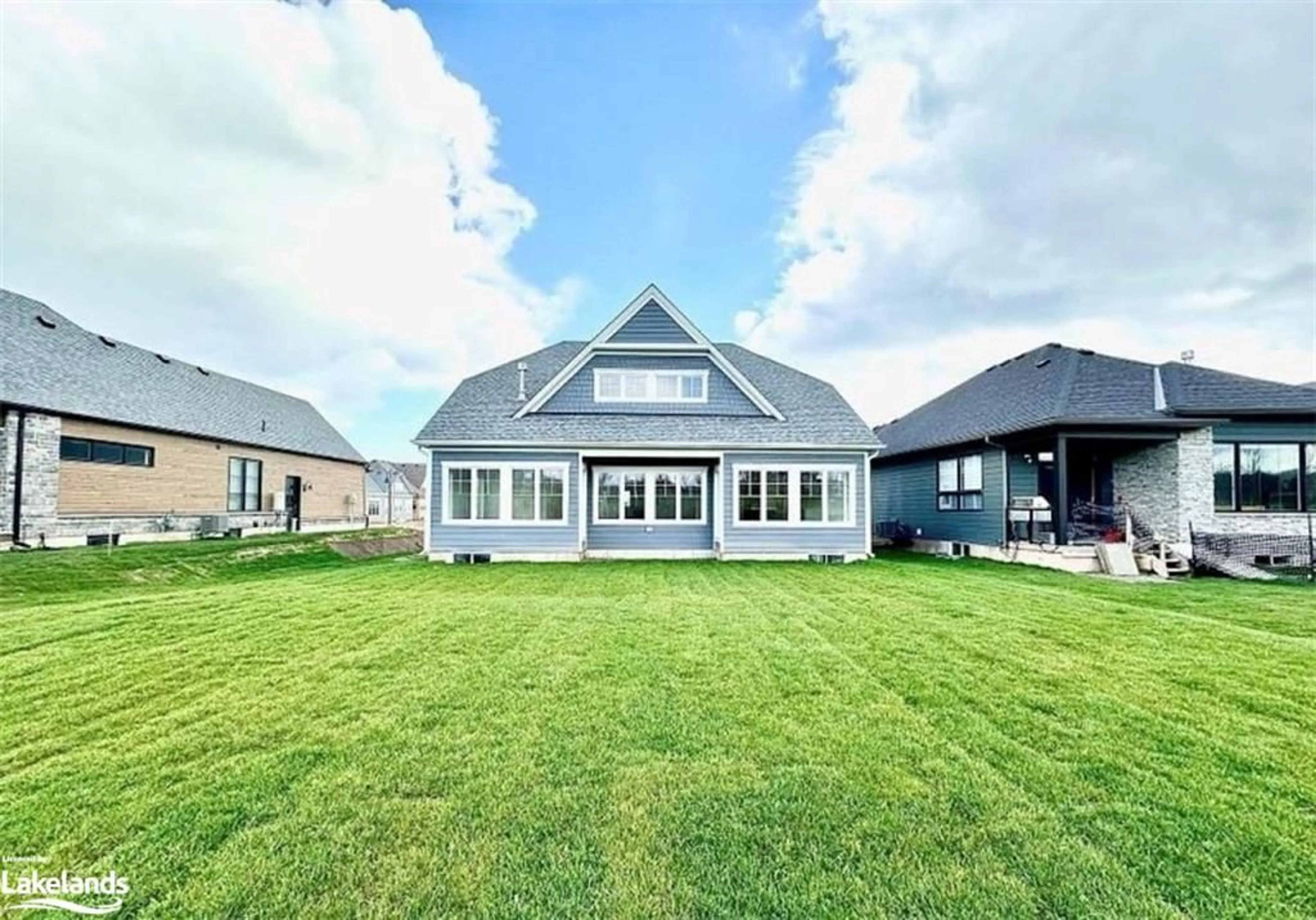 Frontside or backside of a home, the fenced backyard for 236 Snowberry Lane, Kemble Ontario N0H 1S0