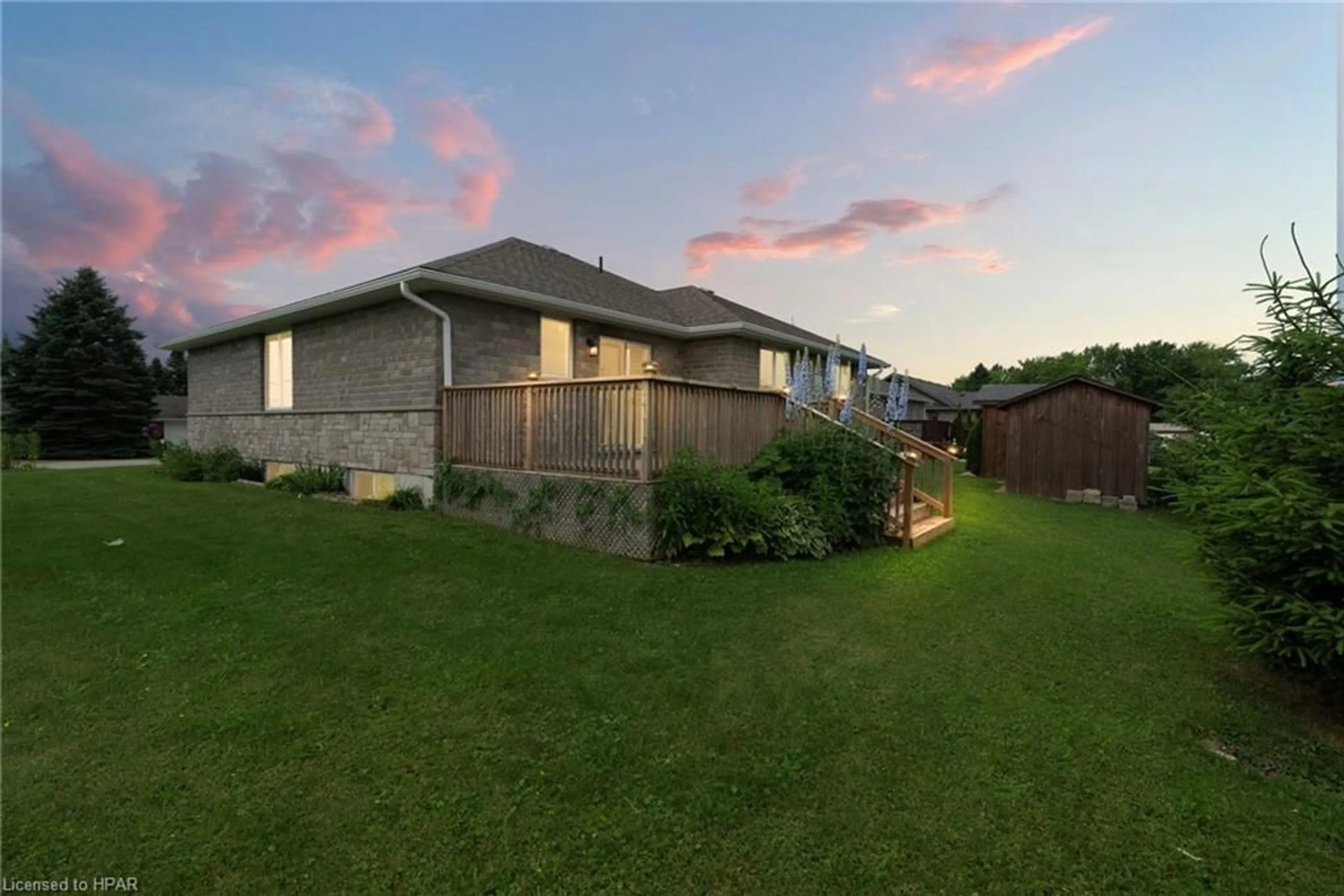 Frontside or backside of a home, the fenced backyard for 39 Minto St, Clifford Ontario N0G 1M0