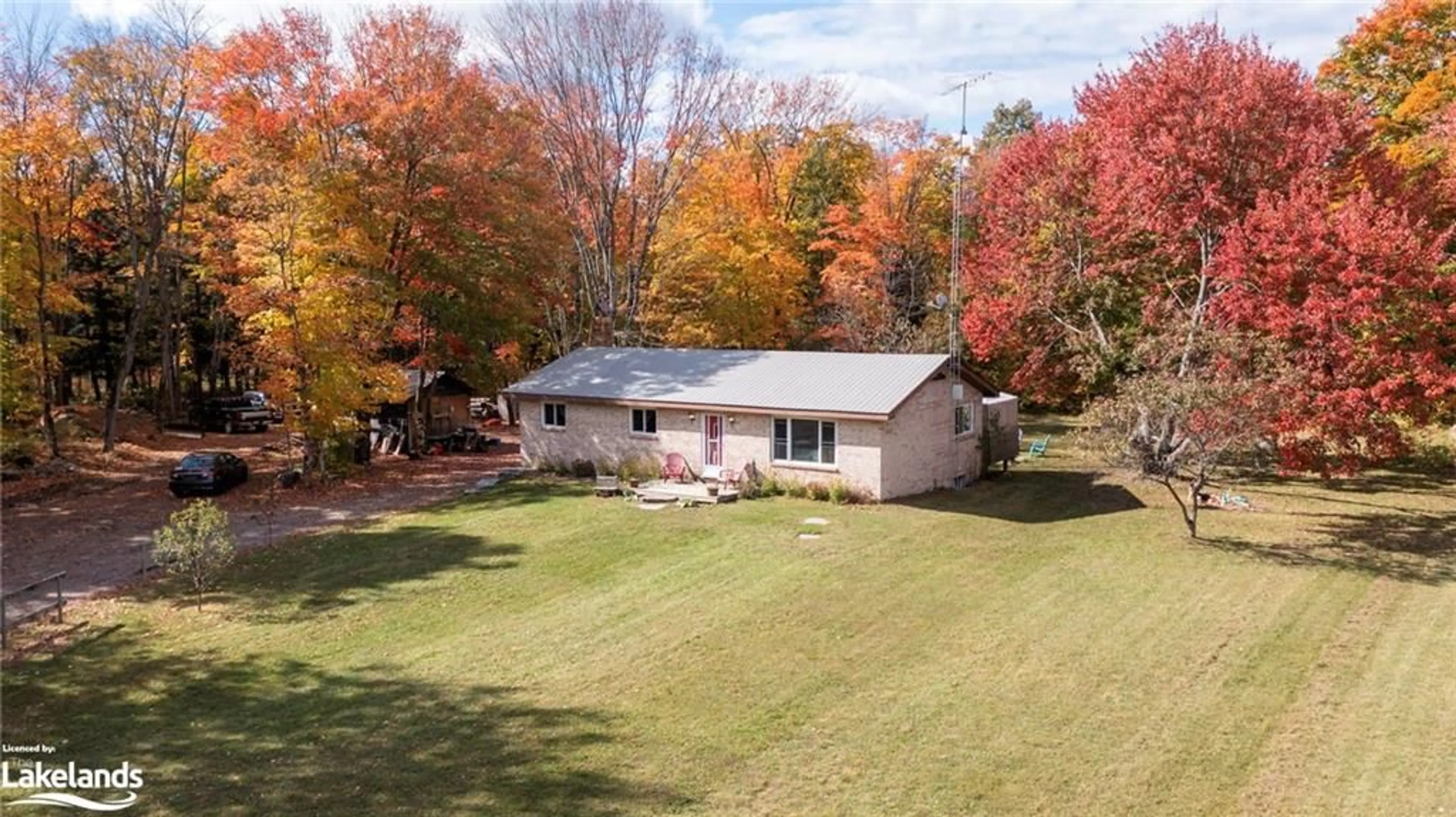 A pic from exterior of the house or condo, the fenced backyard for 4866 Hwy 124 Hwy, Magnetawan Ontario P0A 1P0