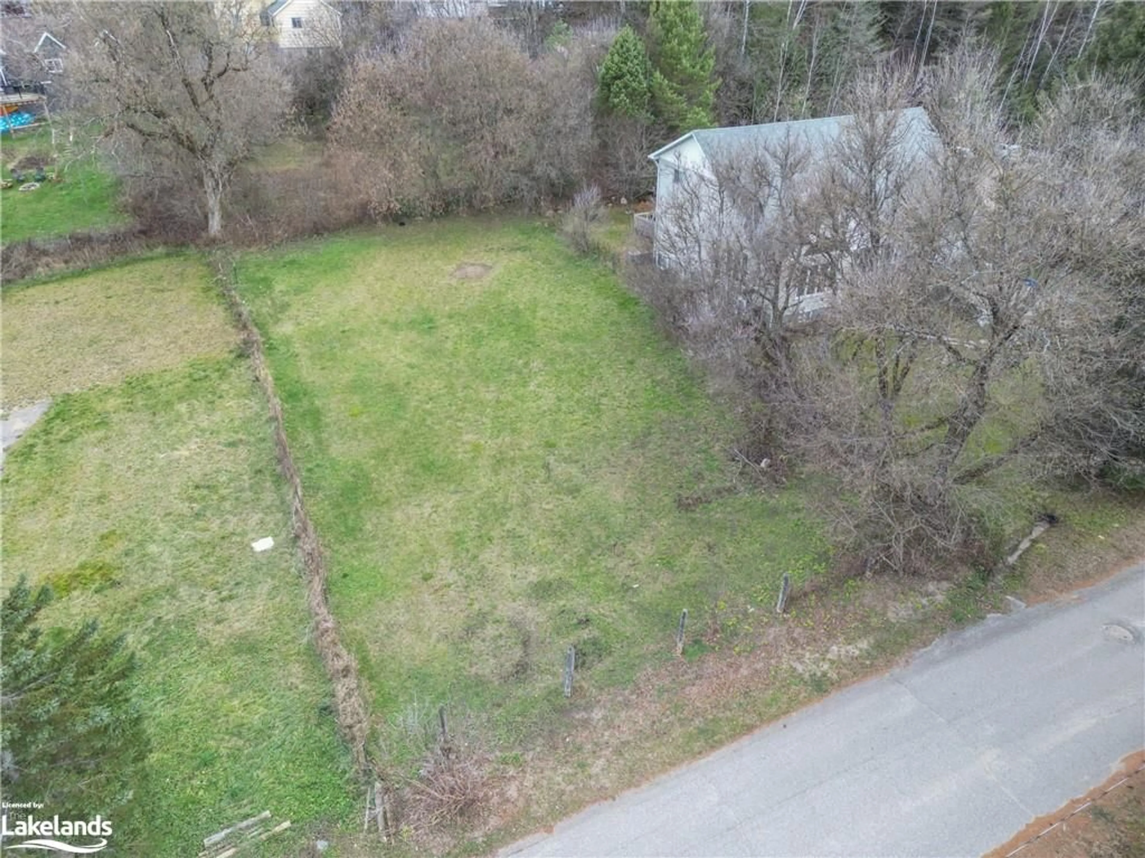 Frontside or backside of a home, the fenced backyard for LOT 4 Elm St, Burk's Falls Ontario P0A 1C0