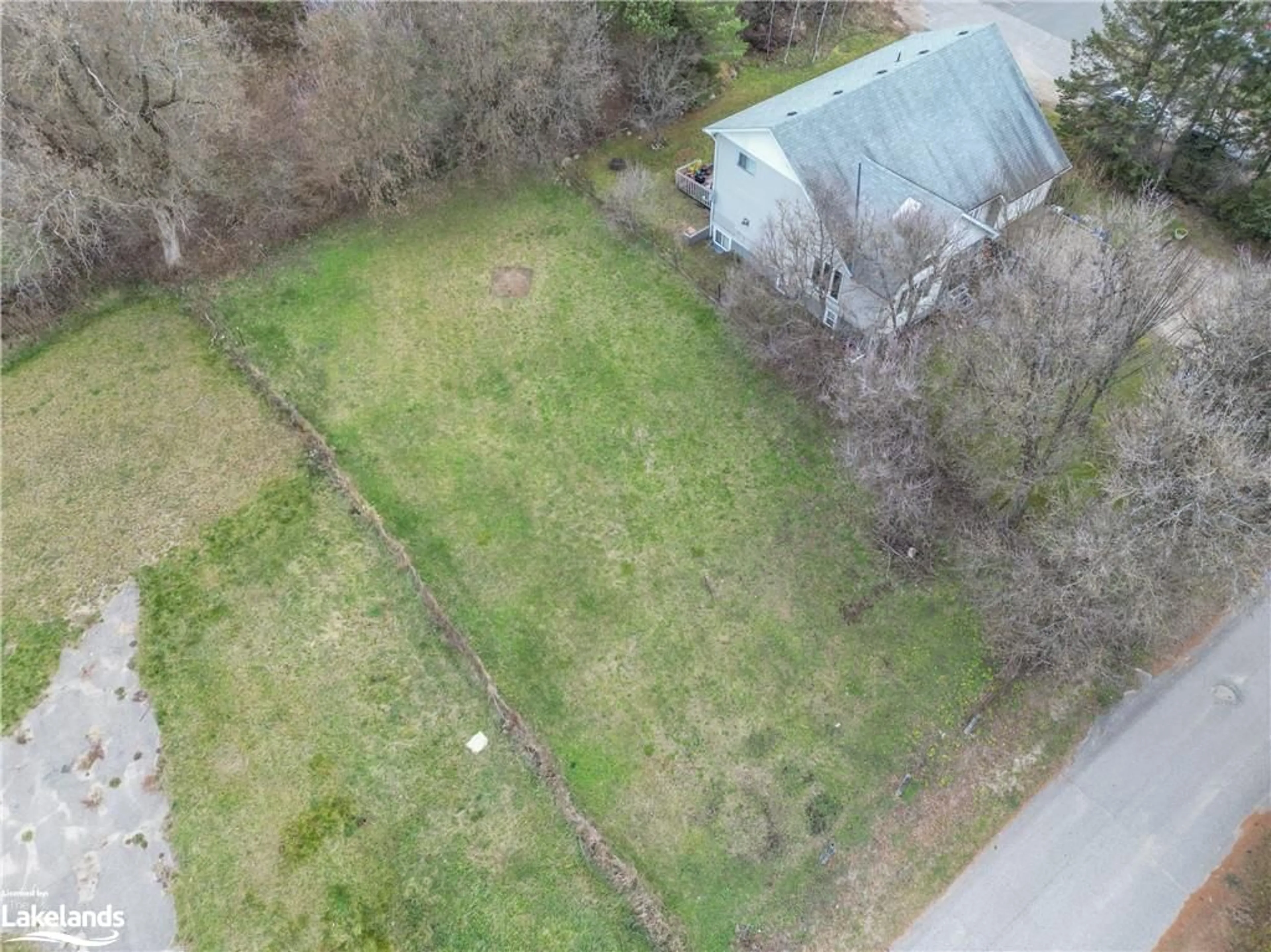 Frontside or backside of a home, the fenced backyard for LOT 4 Elm St, Burk's Falls Ontario P0A 1C0