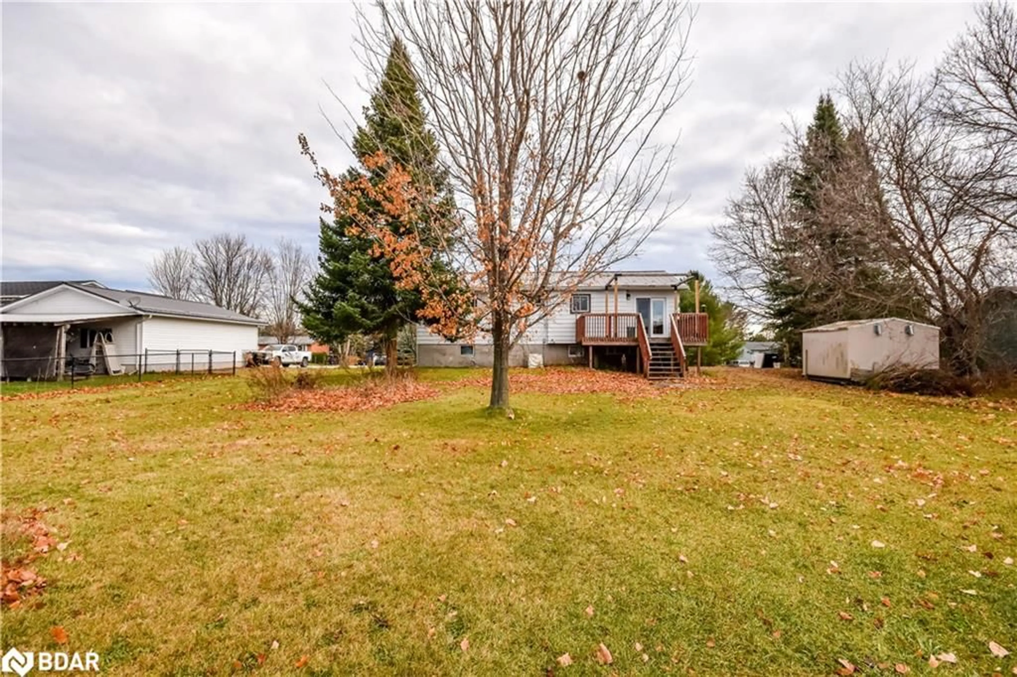 Frontside or backside of a home, the fenced backyard for 14 Preston St St, Warminster Ontario L0K 2G0