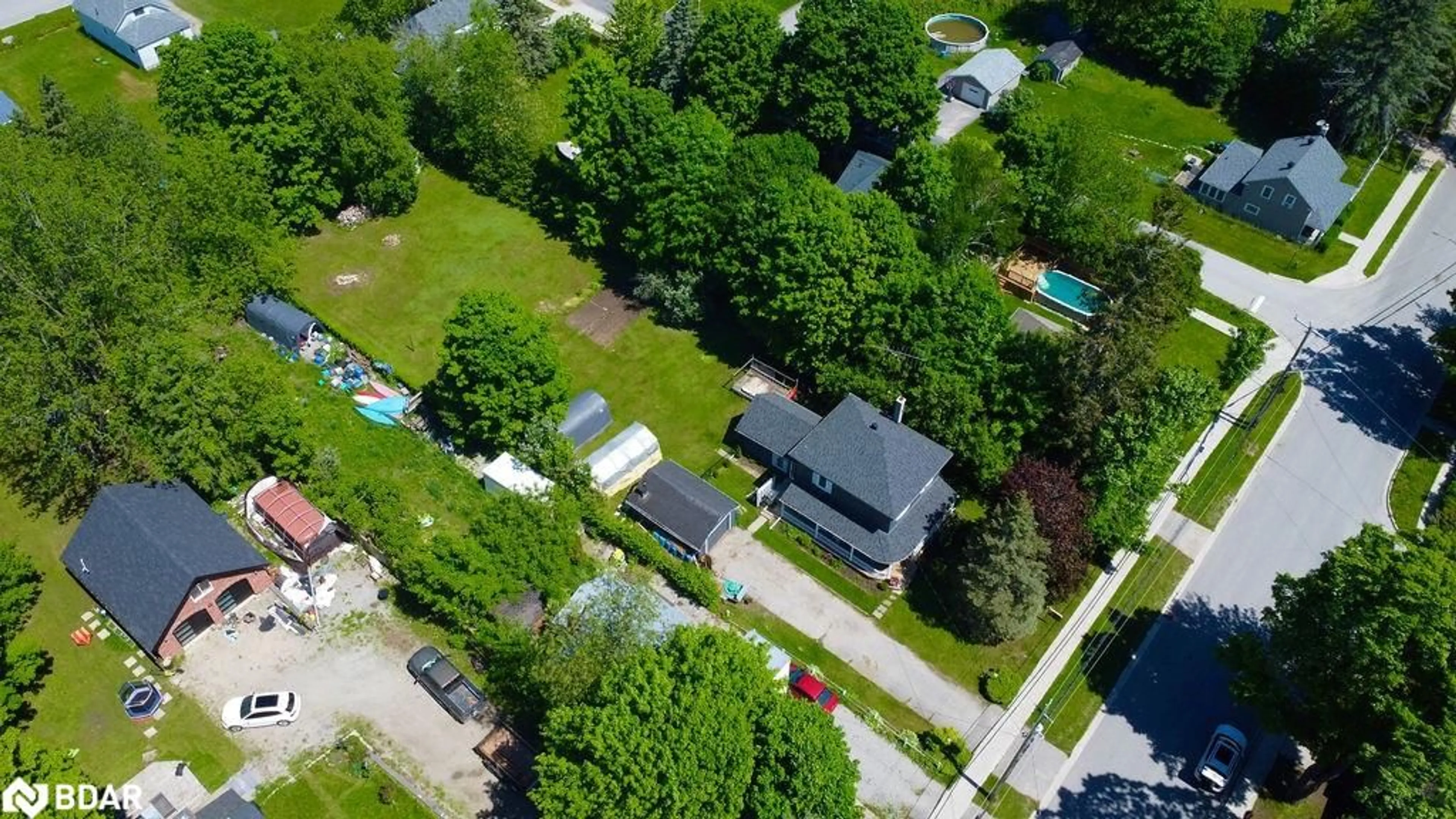 A pic from exterior of the house or condo, the fenced backyard for 14 Mill Street, Hillsdale Ontario L0L 1Y0