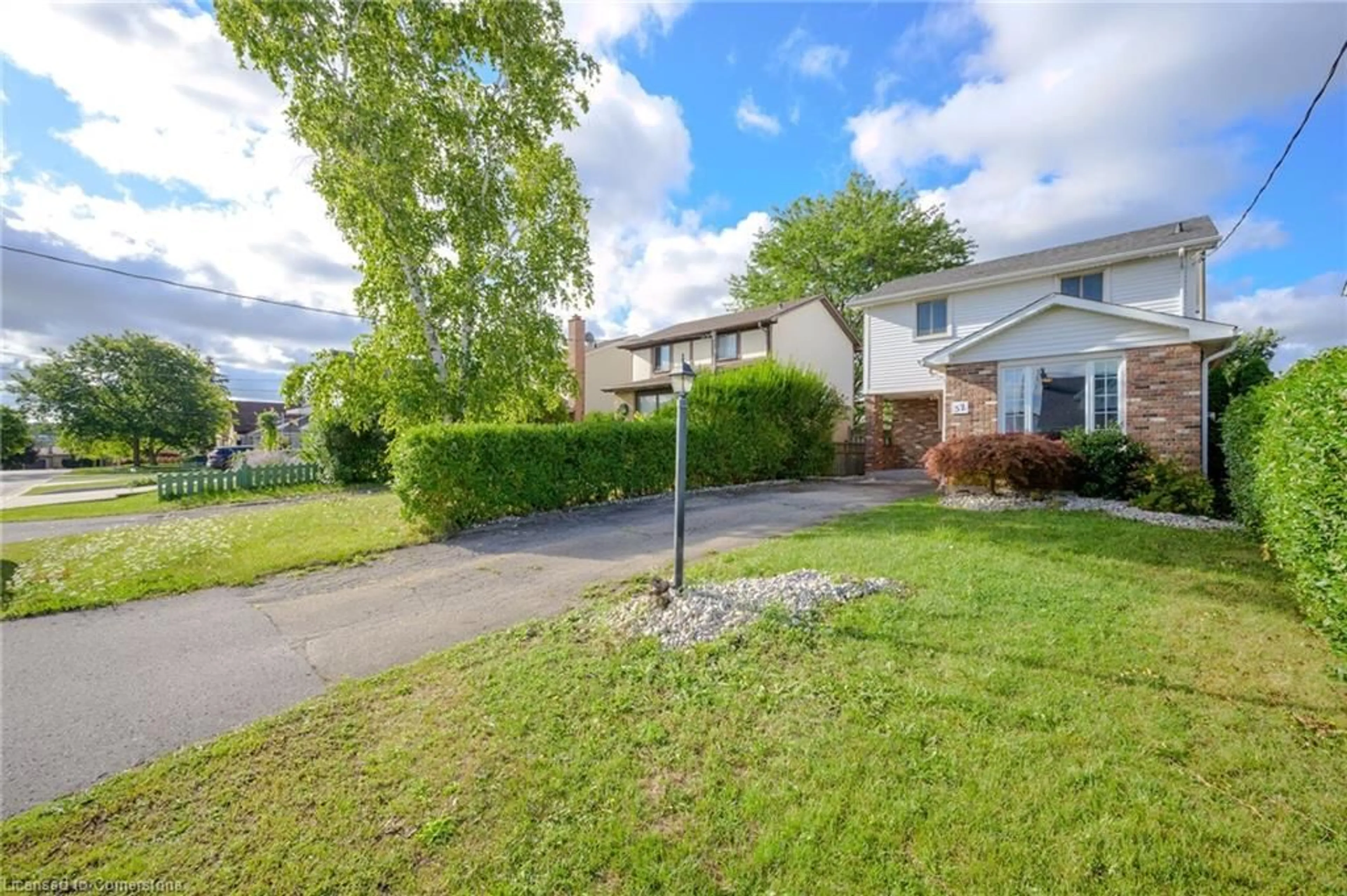 Frontside or backside of a home, the fenced backyard for 57 Tunis St, St. Catharines Ontario L2S 1E6