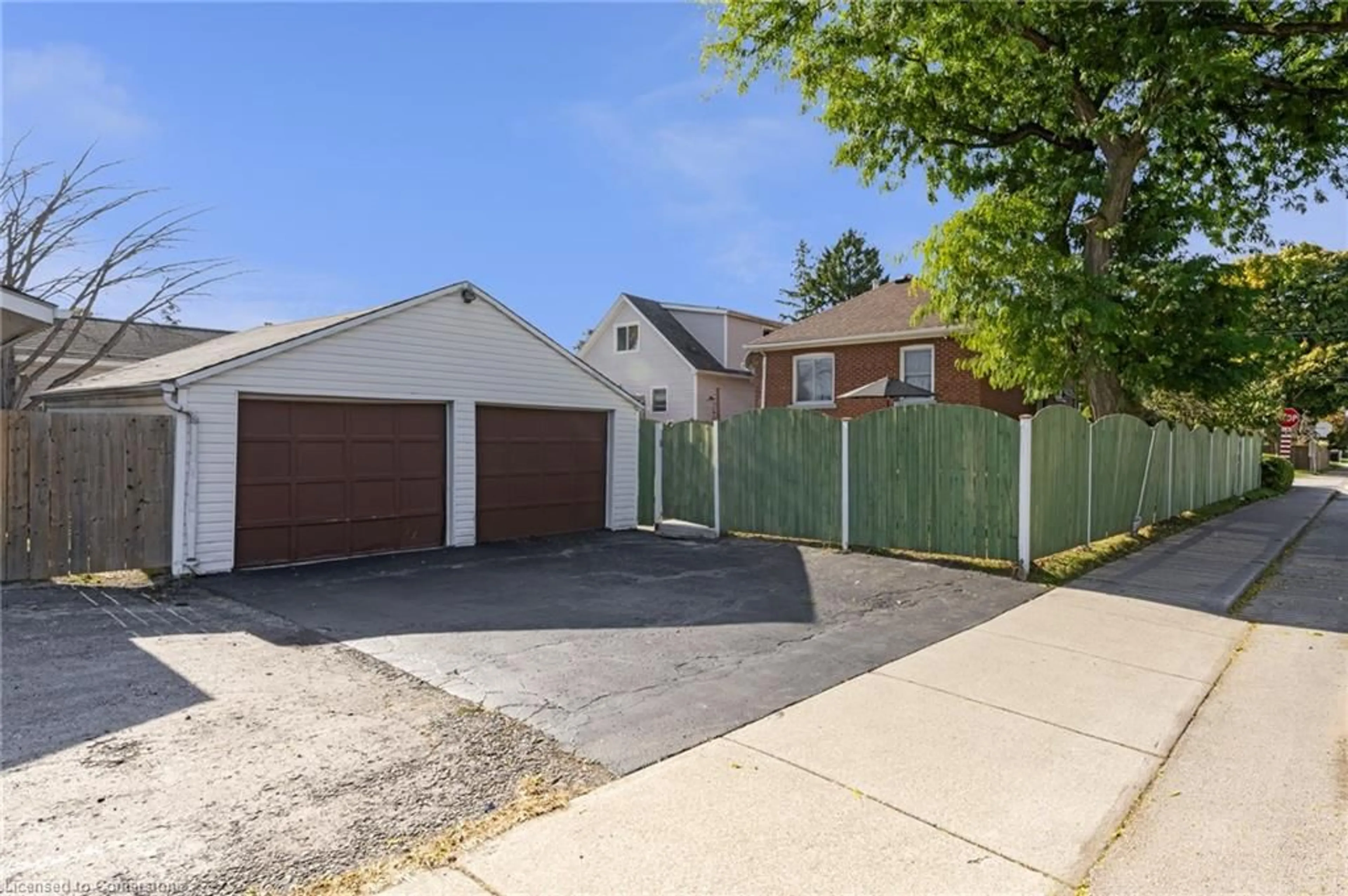 Frontside or backside of a home, the fenced backyard for 155 Walter Ave, Hamilton Ontario L8K 3L1