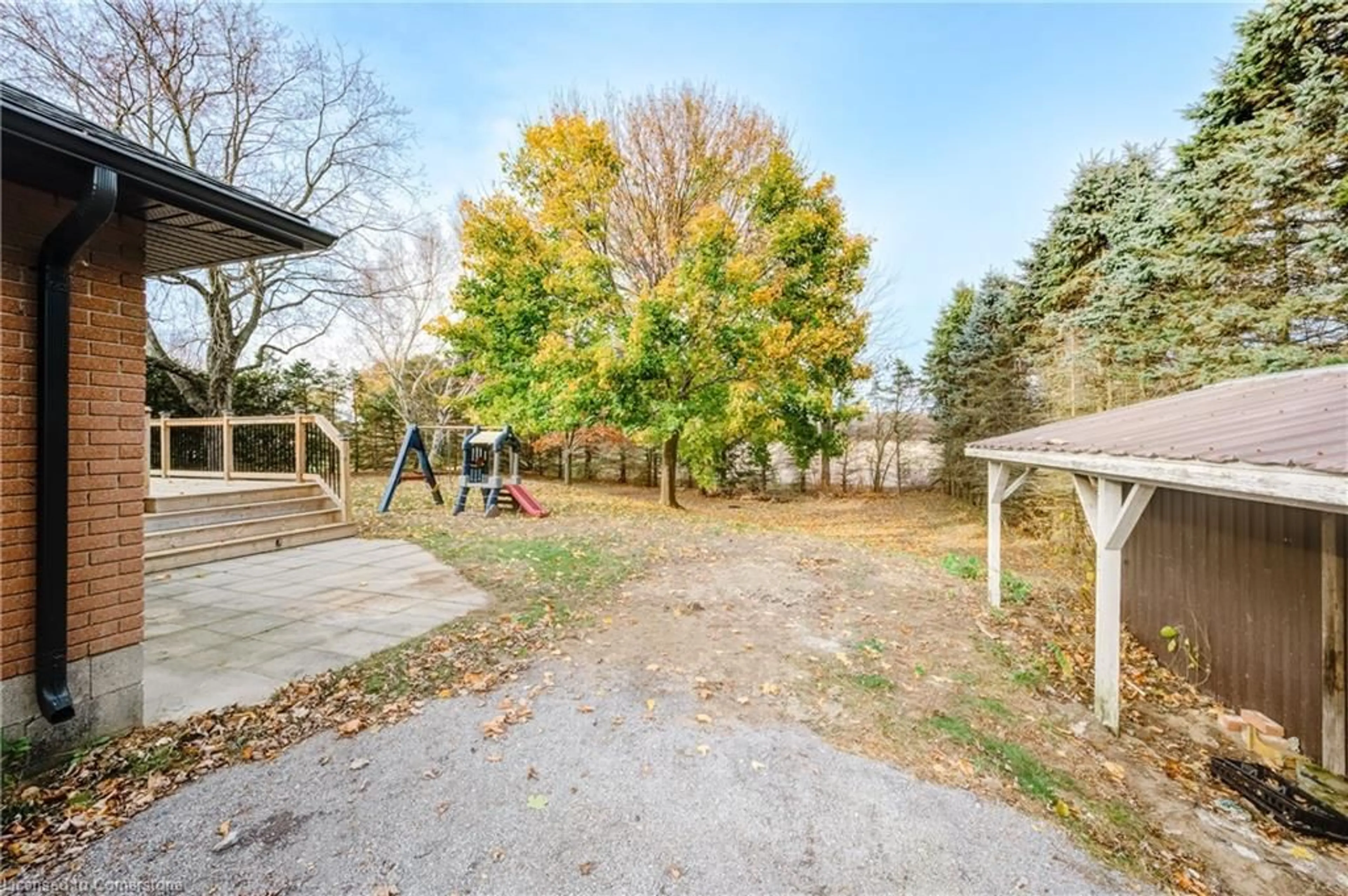 Patio, the fenced backyard for 56556 Heritage Line, Straffordville Ontario M0J 1Y0