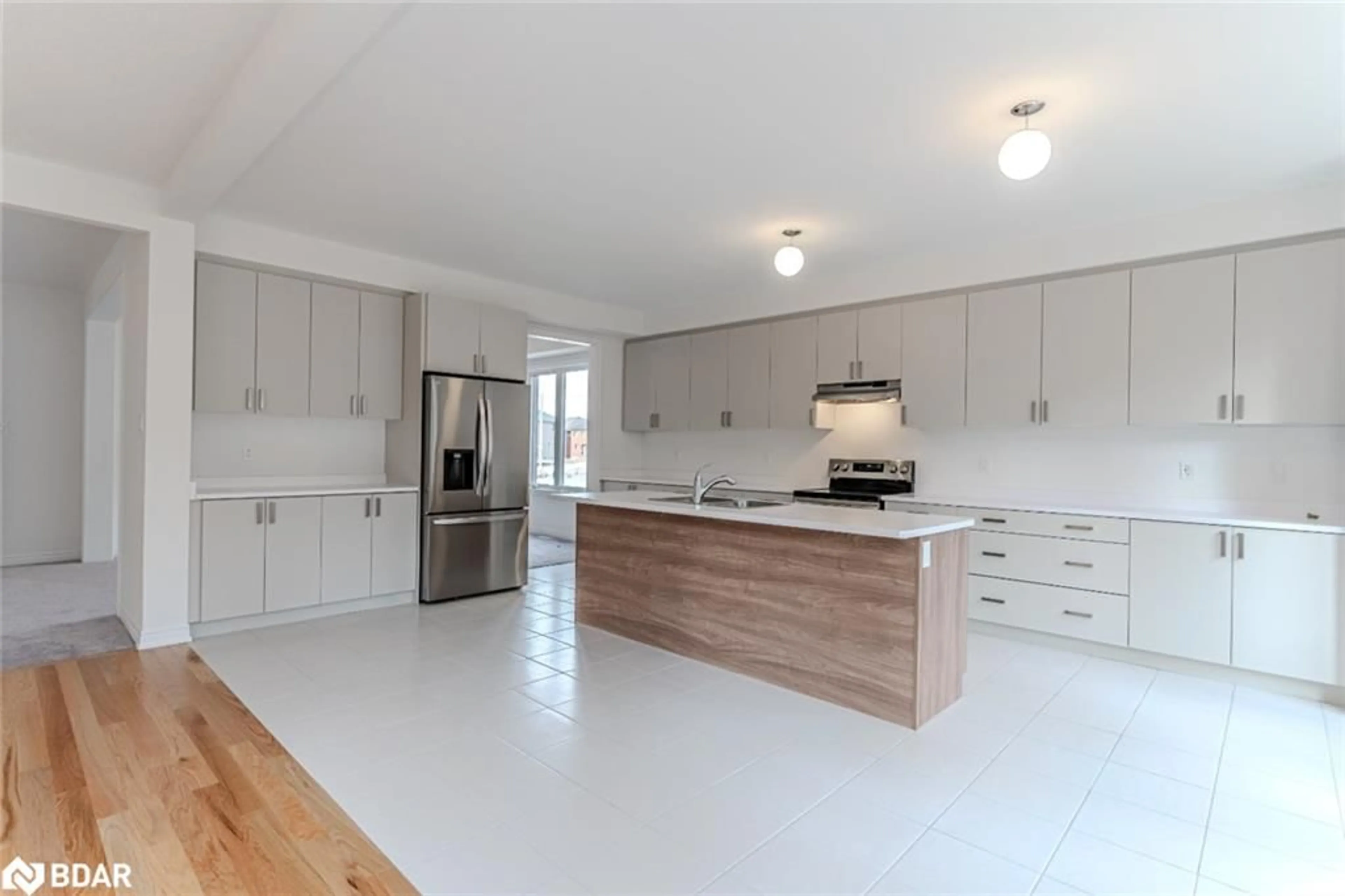 Open concept kitchen for 41 Wakefield Blvd, Essa Ontario L3W 0L8