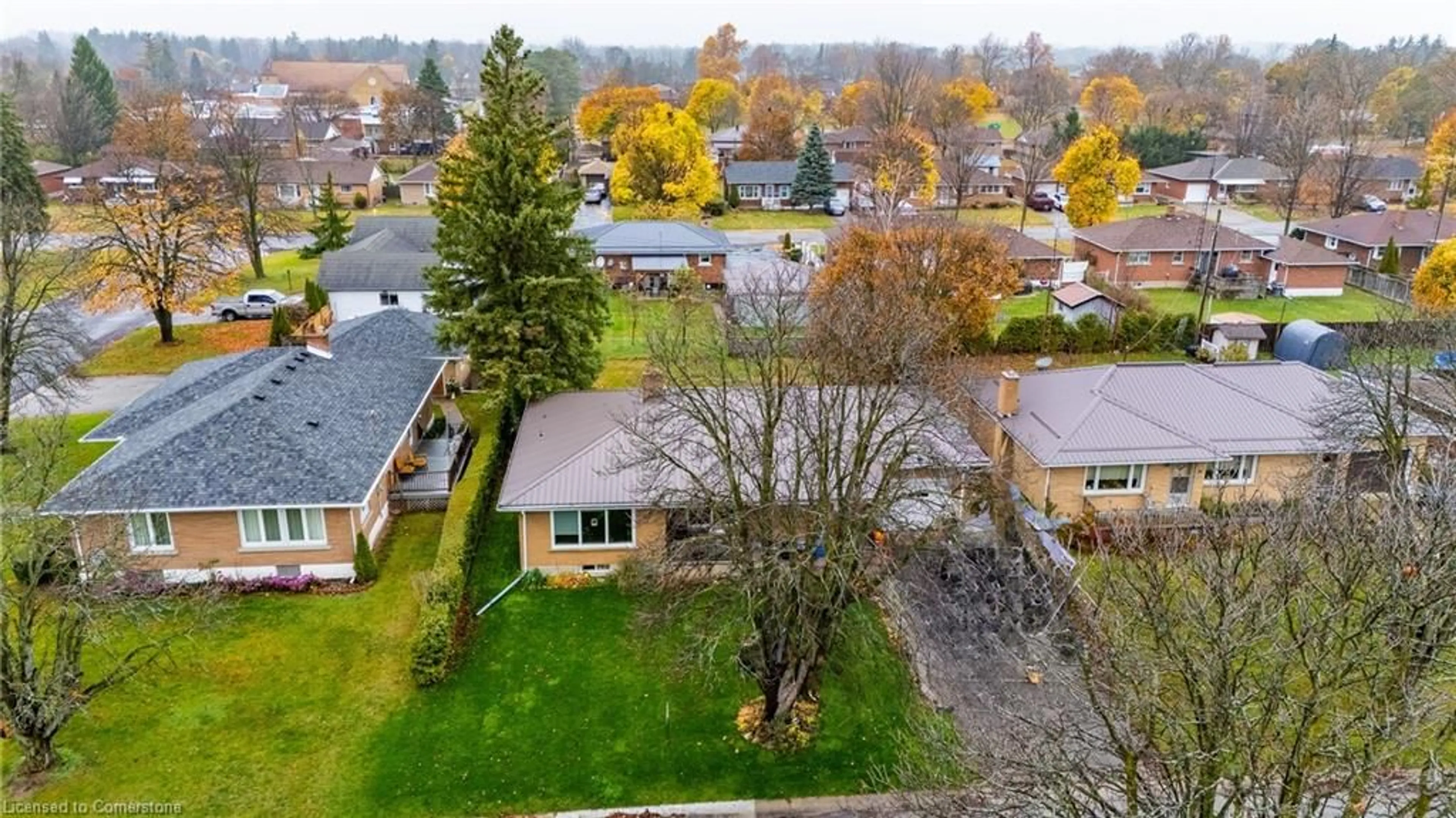 A pic from exterior of the house or condo, the fenced backyard for 135 Harris St, Delhi Ontario N4B 1J9