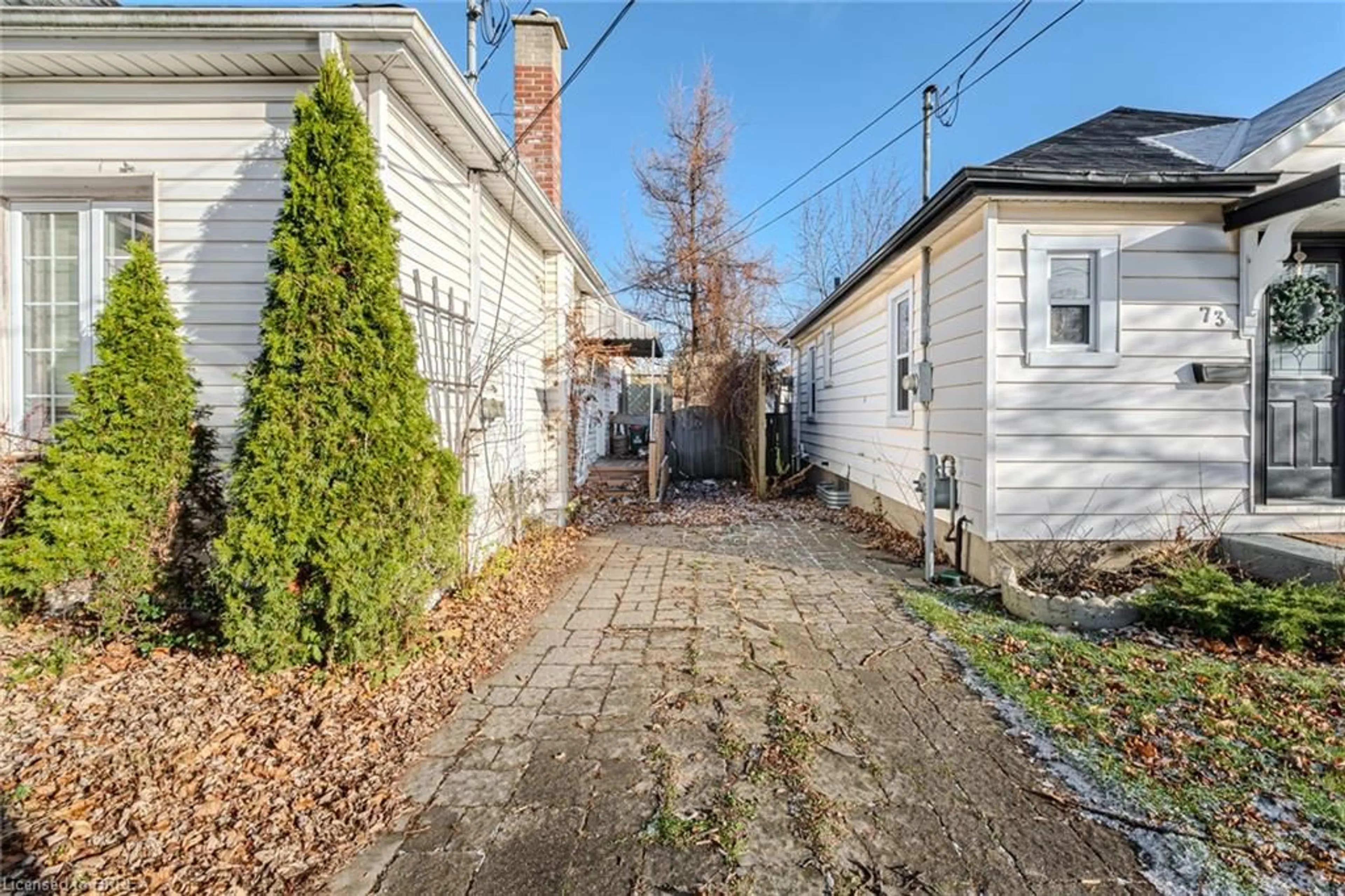 Frontside or backside of a home, the fenced backyard for 75 St George St, Brantford Ontario N3R 1V5