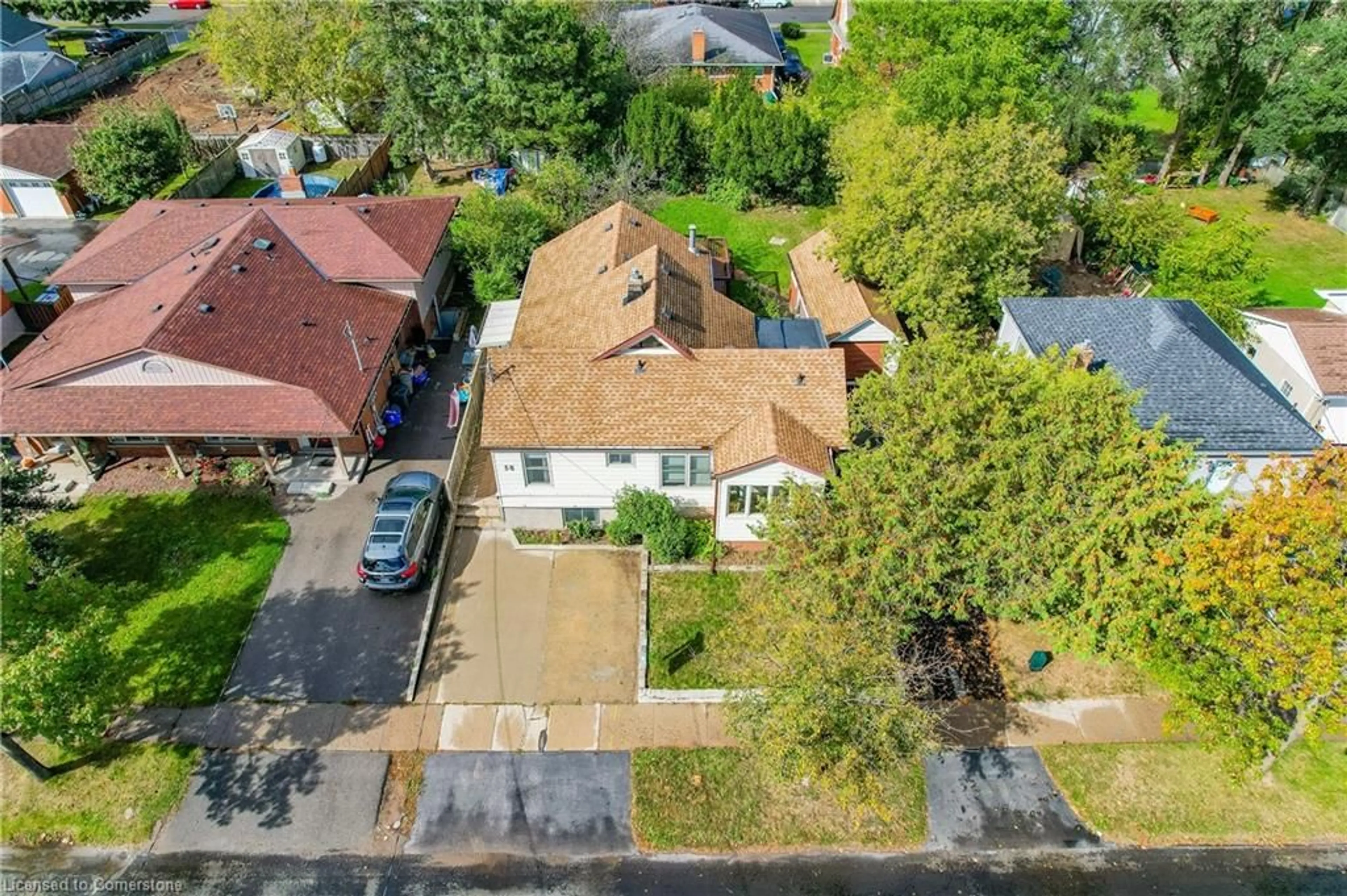 Frontside or backside of a home, the fenced backyard for 58 Fifth Ave, Kitchener Ontario N2C 1P4