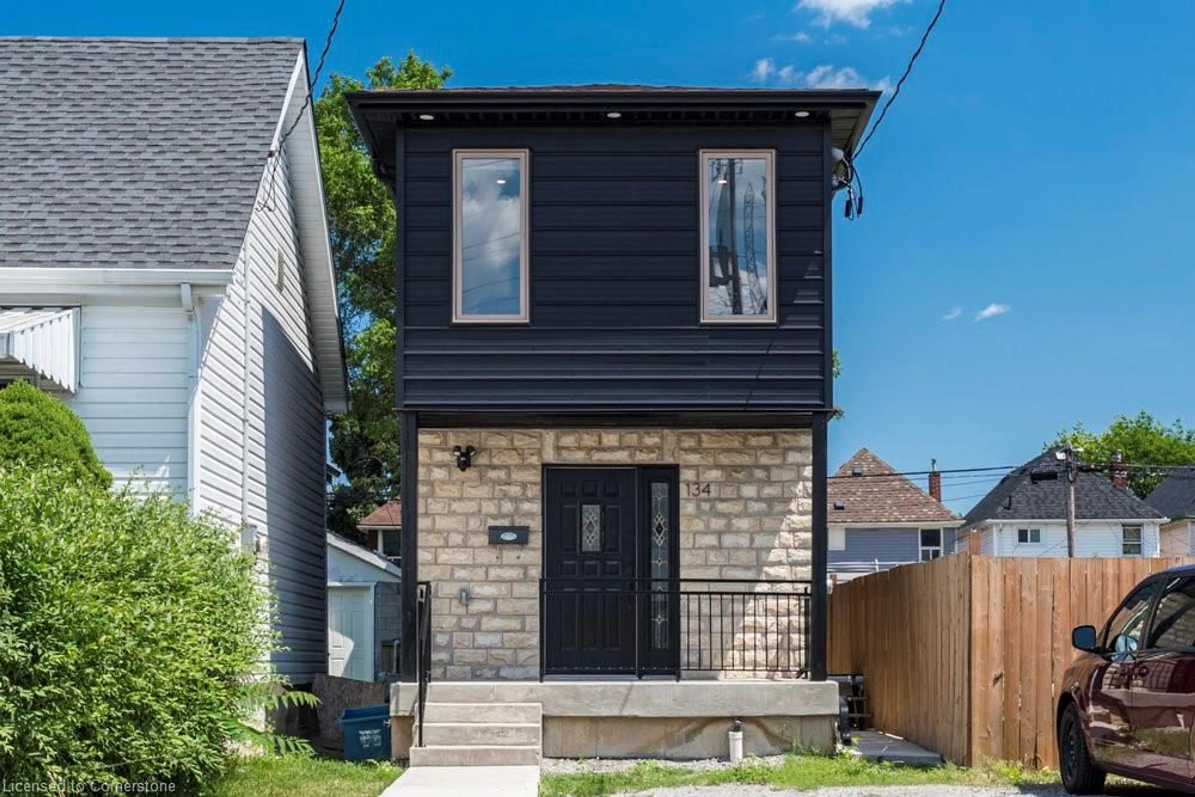 Frontside or backside of a home, the front or back of building for 134 Gibson Ave, Hamilton Ontario L8L 6J8