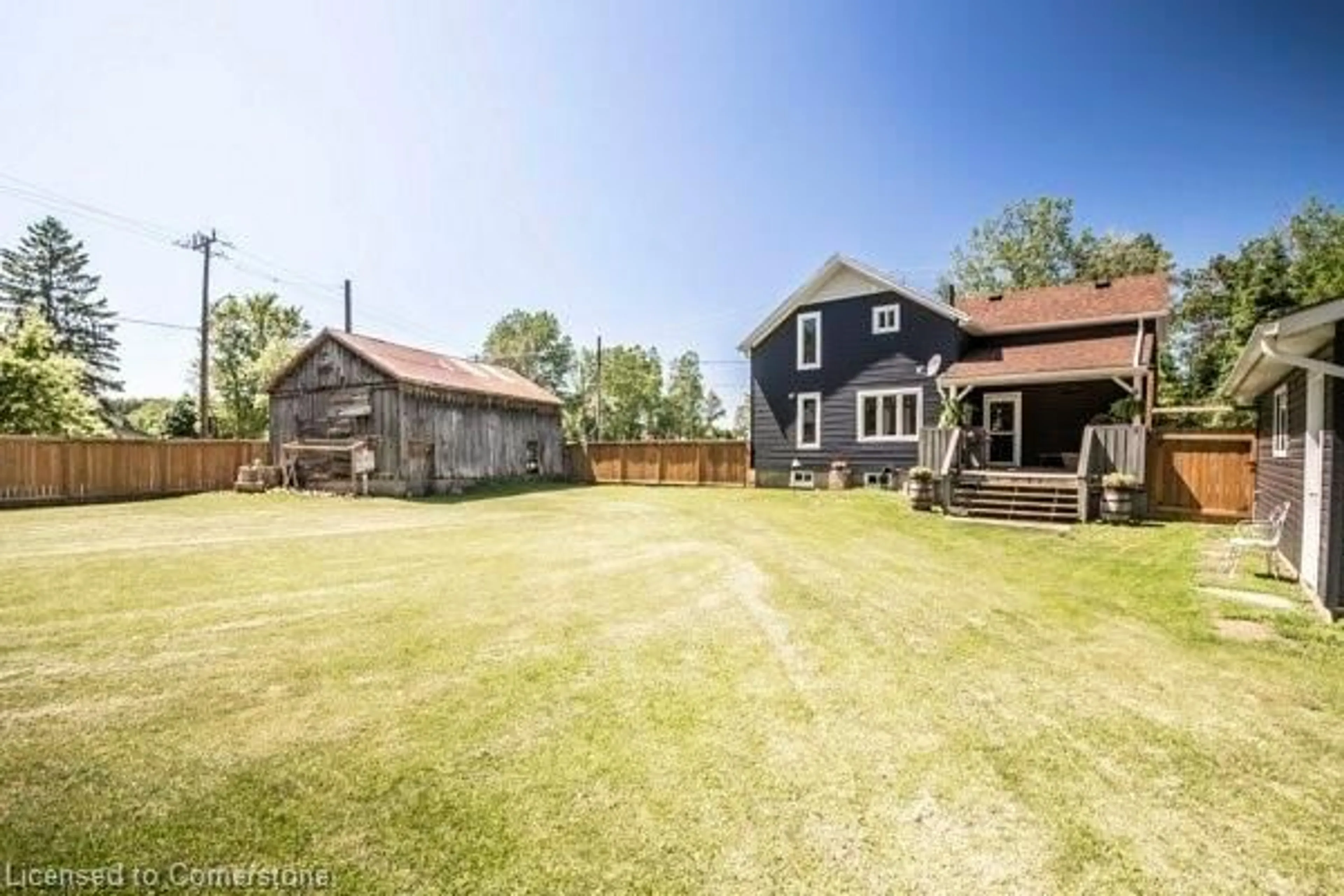 Frontside or backside of a home, the fenced backyard for 707 Conservation Dr, Waterloo Ontario N2J 3Z4