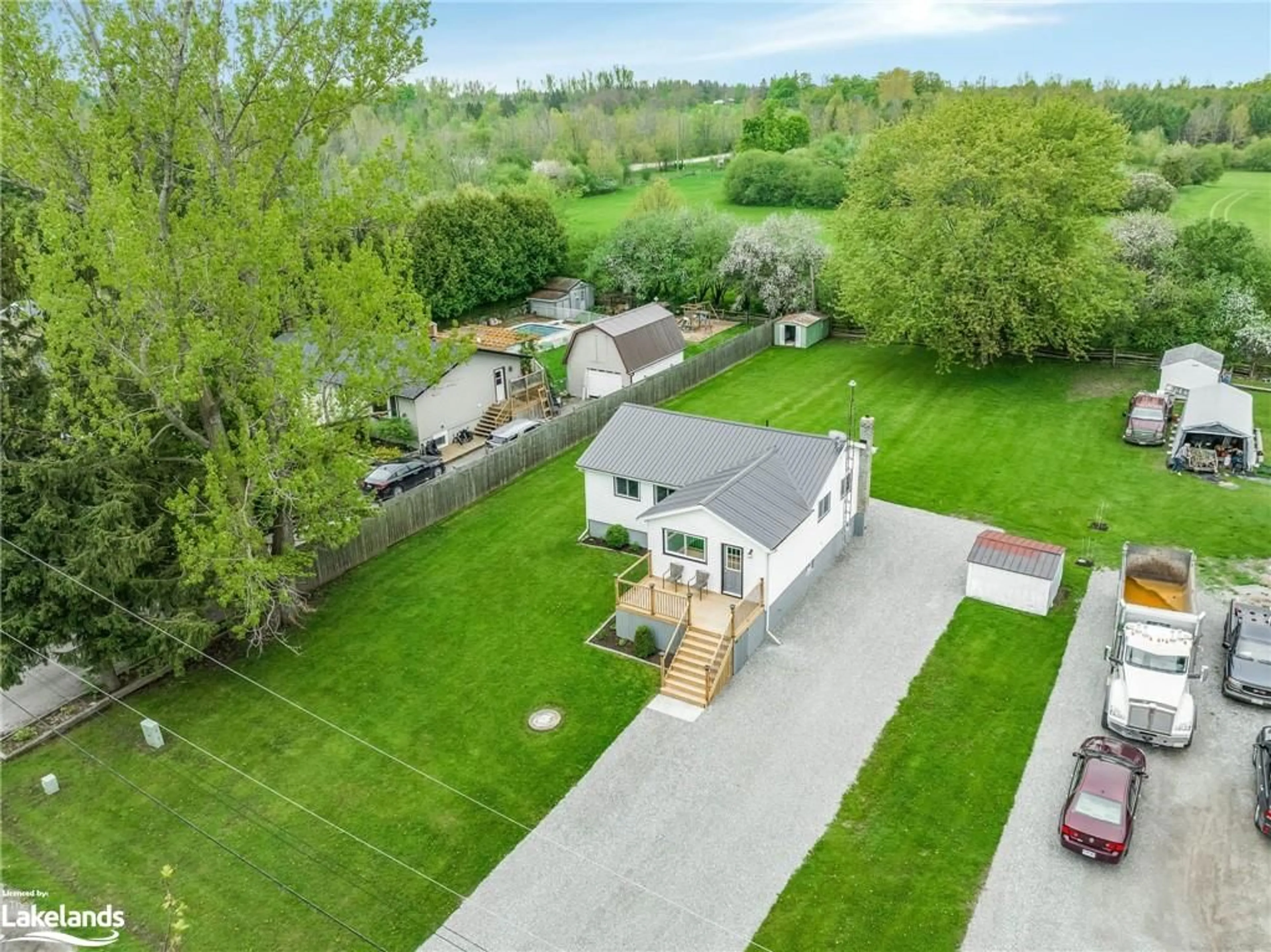 Frontside or backside of a home, the fenced backyard for 13 Butternut Dr, Lindsay Ontario K9V 4R1