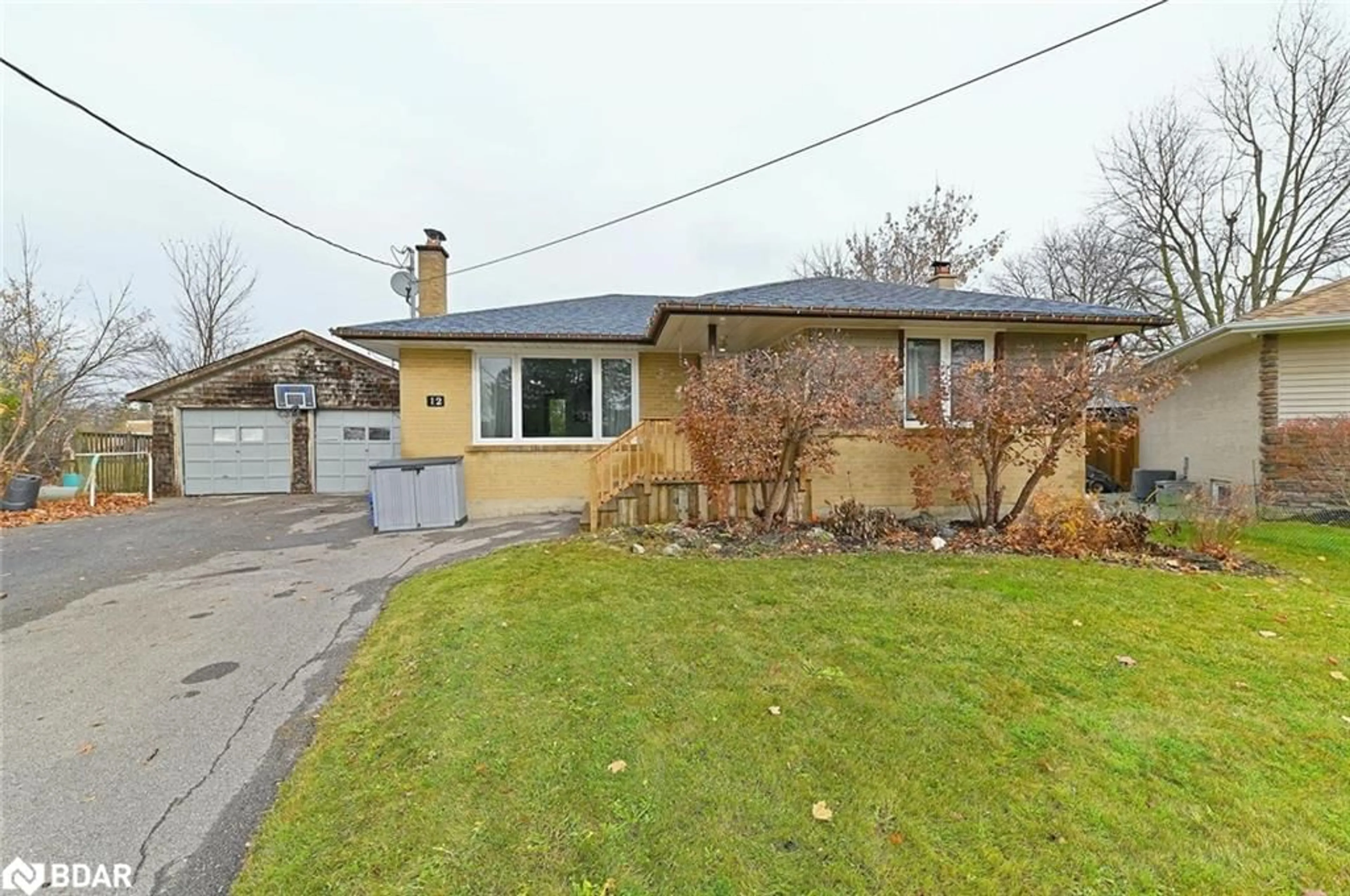 Frontside or backside of a home, the street view for 12 Mackenzie Dr, Georgetown Ontario L7G 4B9