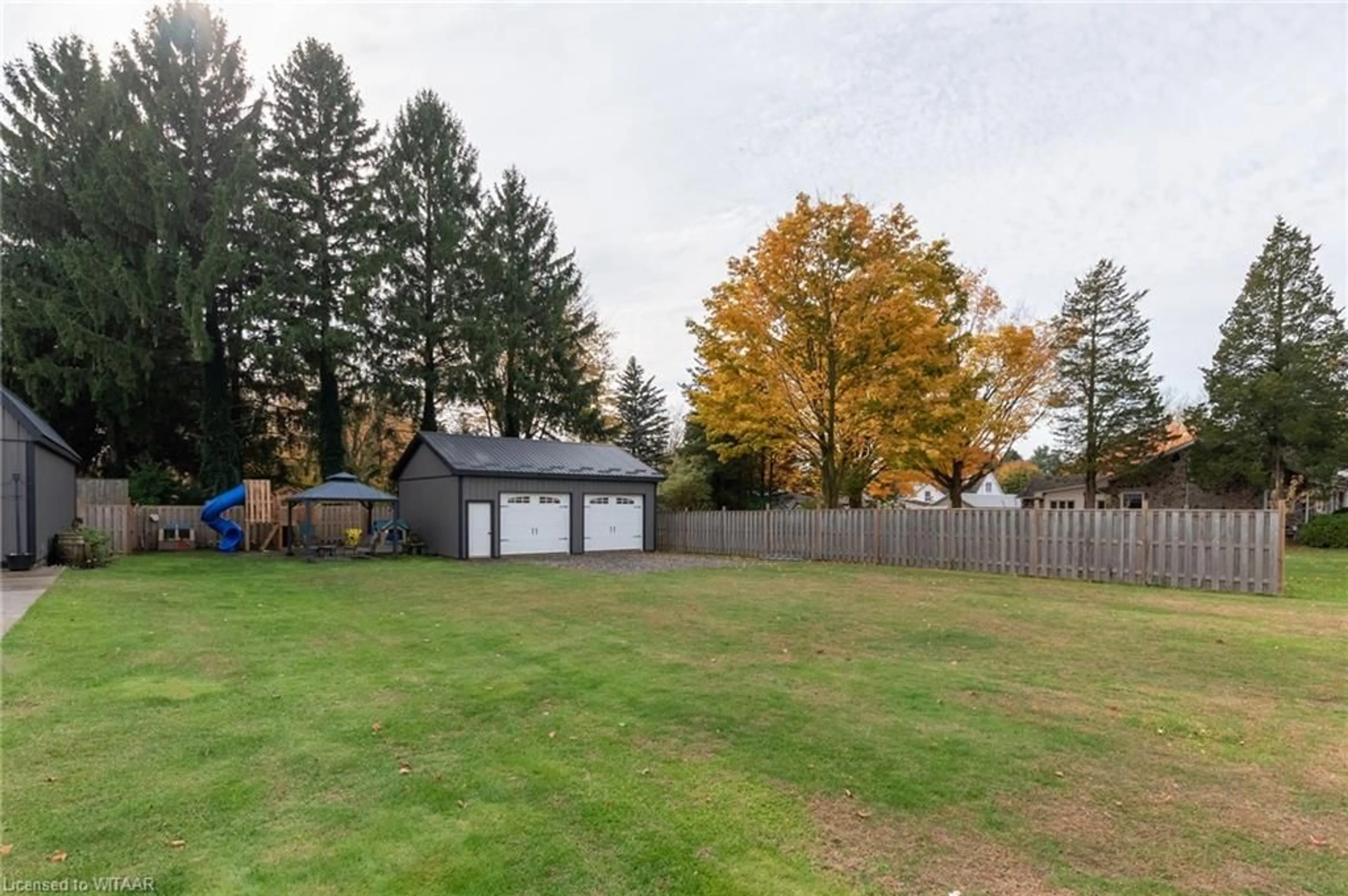 Frontside or backside of a home, the fenced backyard for 55861 Third S/S St, Straffordville Ontario N0J 1T0