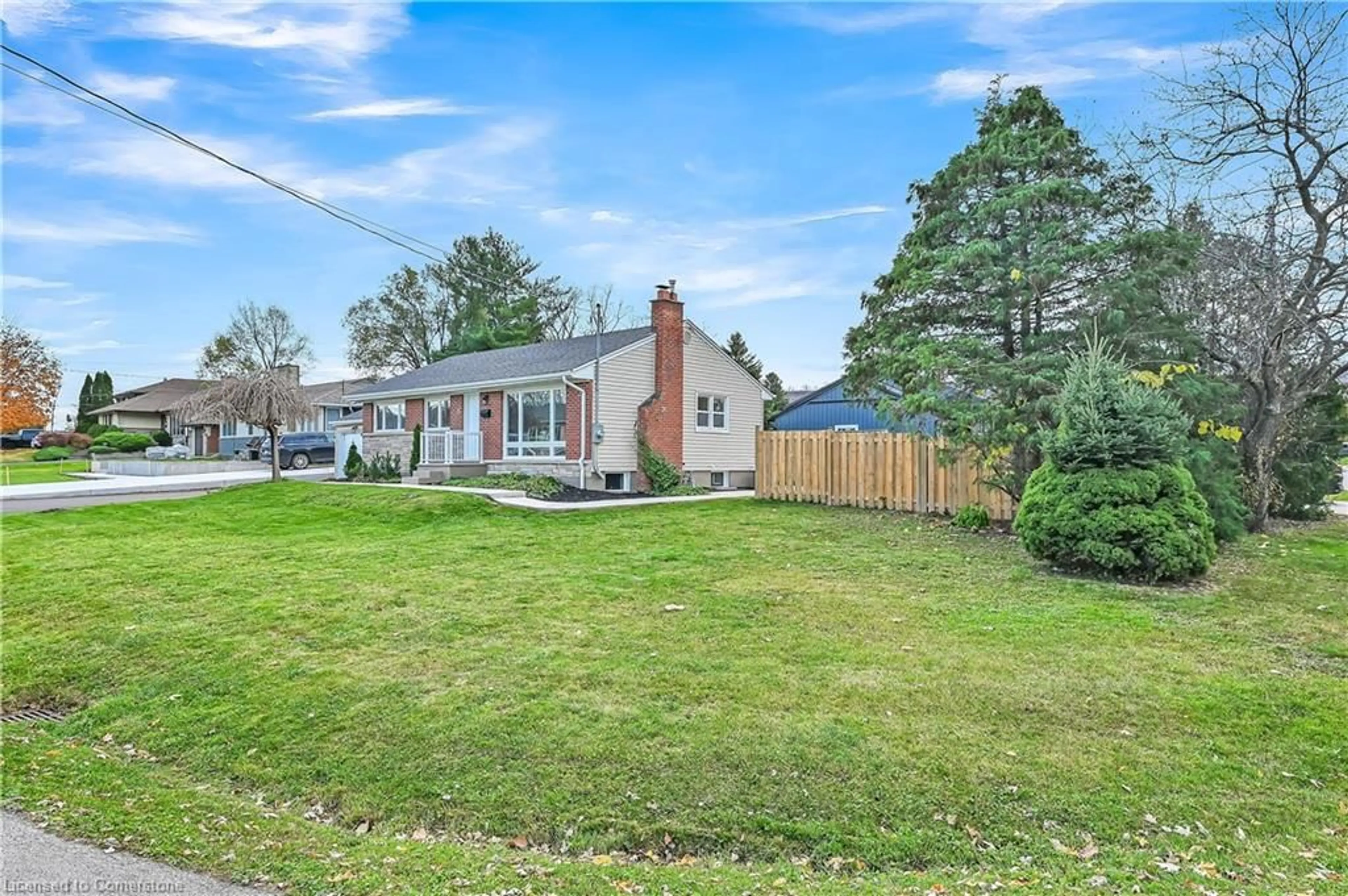 Frontside or backside of a home, the fenced backyard for 4 James Ave, Stoney Creek Ontario L8G 3K1