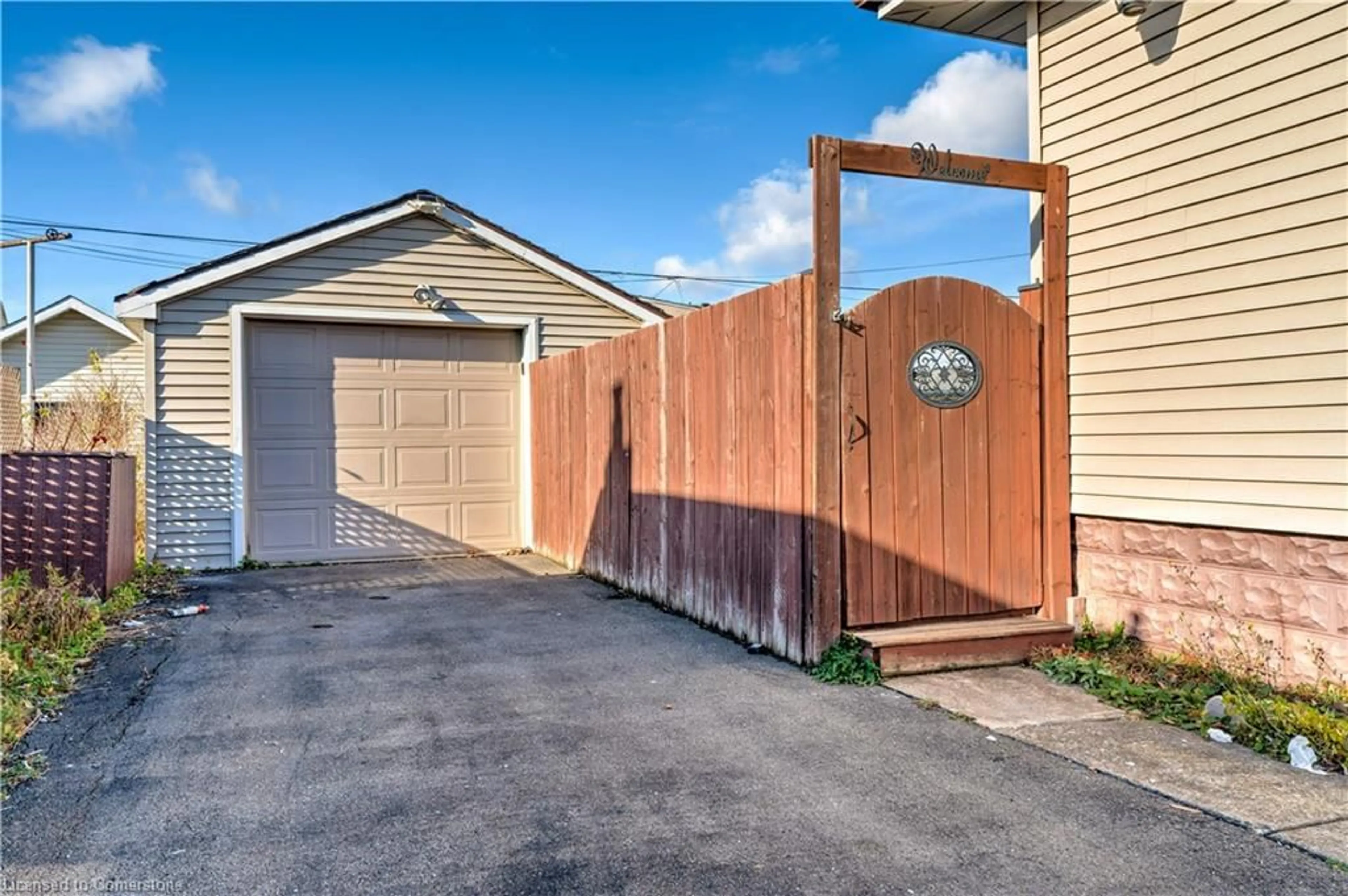 A pic from exterior of the house or condo, the fenced backyard for 662 Harriet St, Welland Ontario L3B 2J3