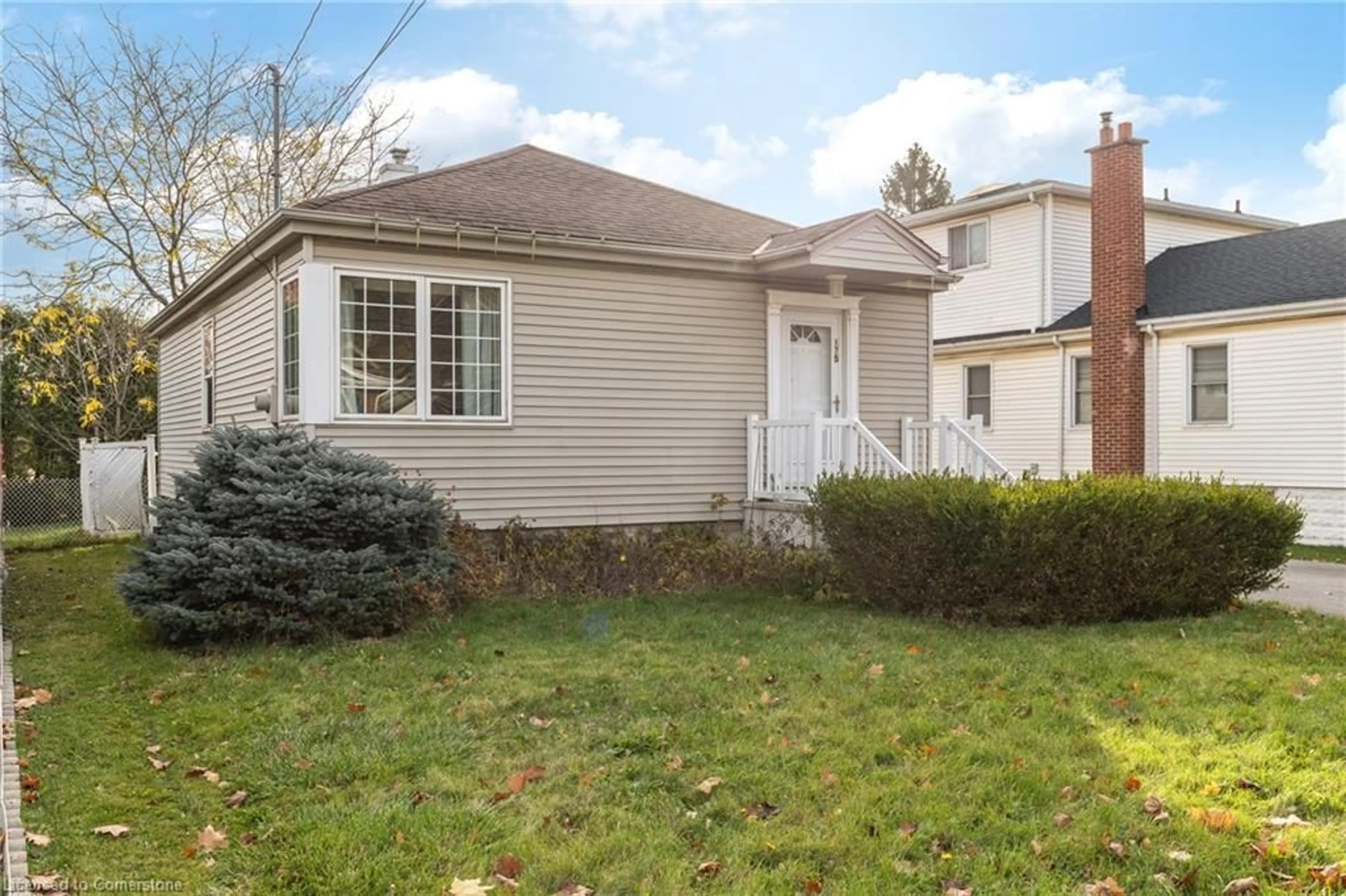 Frontside or backside of a home, the fenced backyard for 175 Rosedale Ave, Hamilton Ontario L8K 4N4