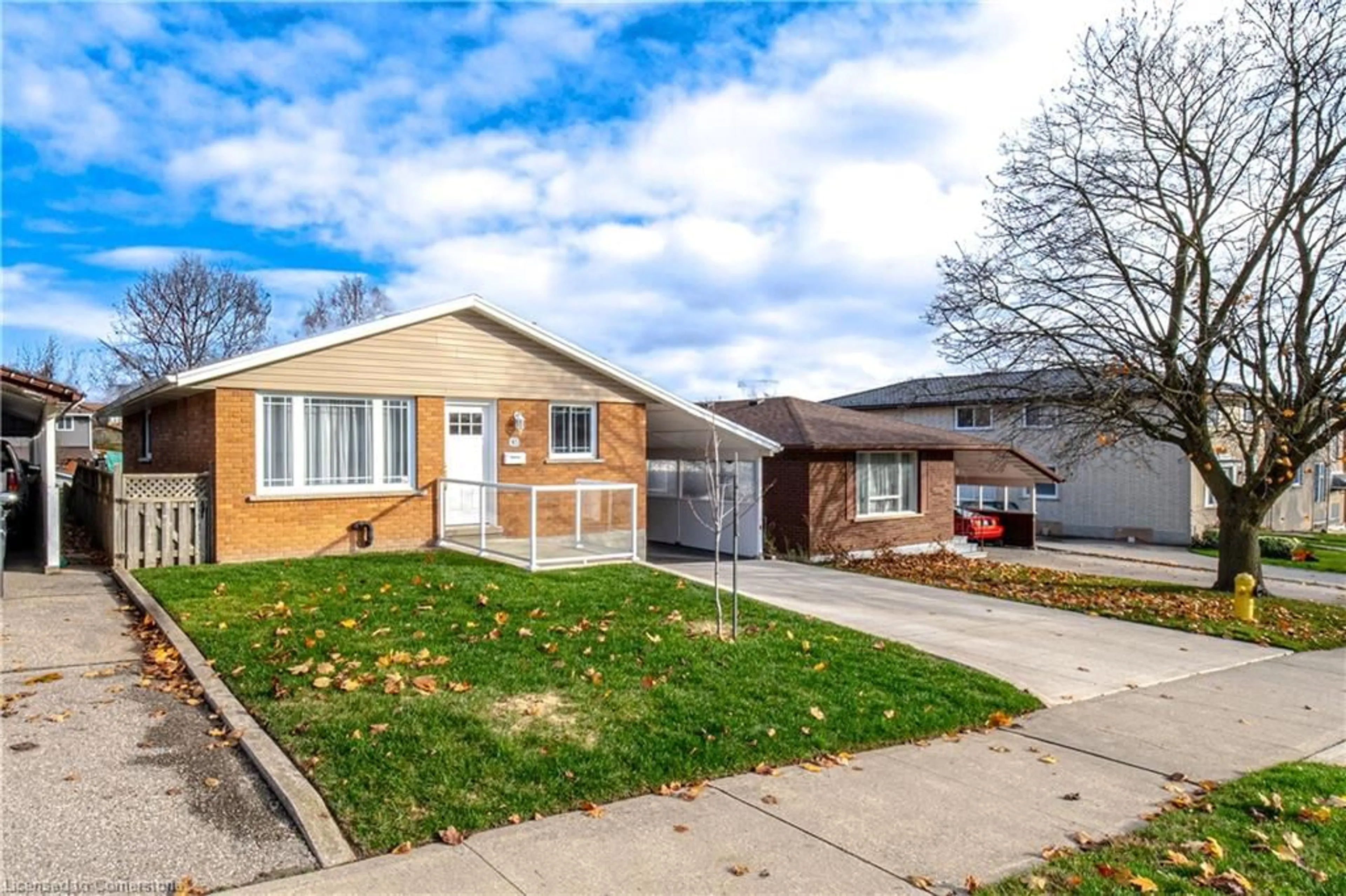 Frontside or backside of a home, the fenced backyard for 93 Lowrey Ave, Cambridge Ontario N1R 4Z7