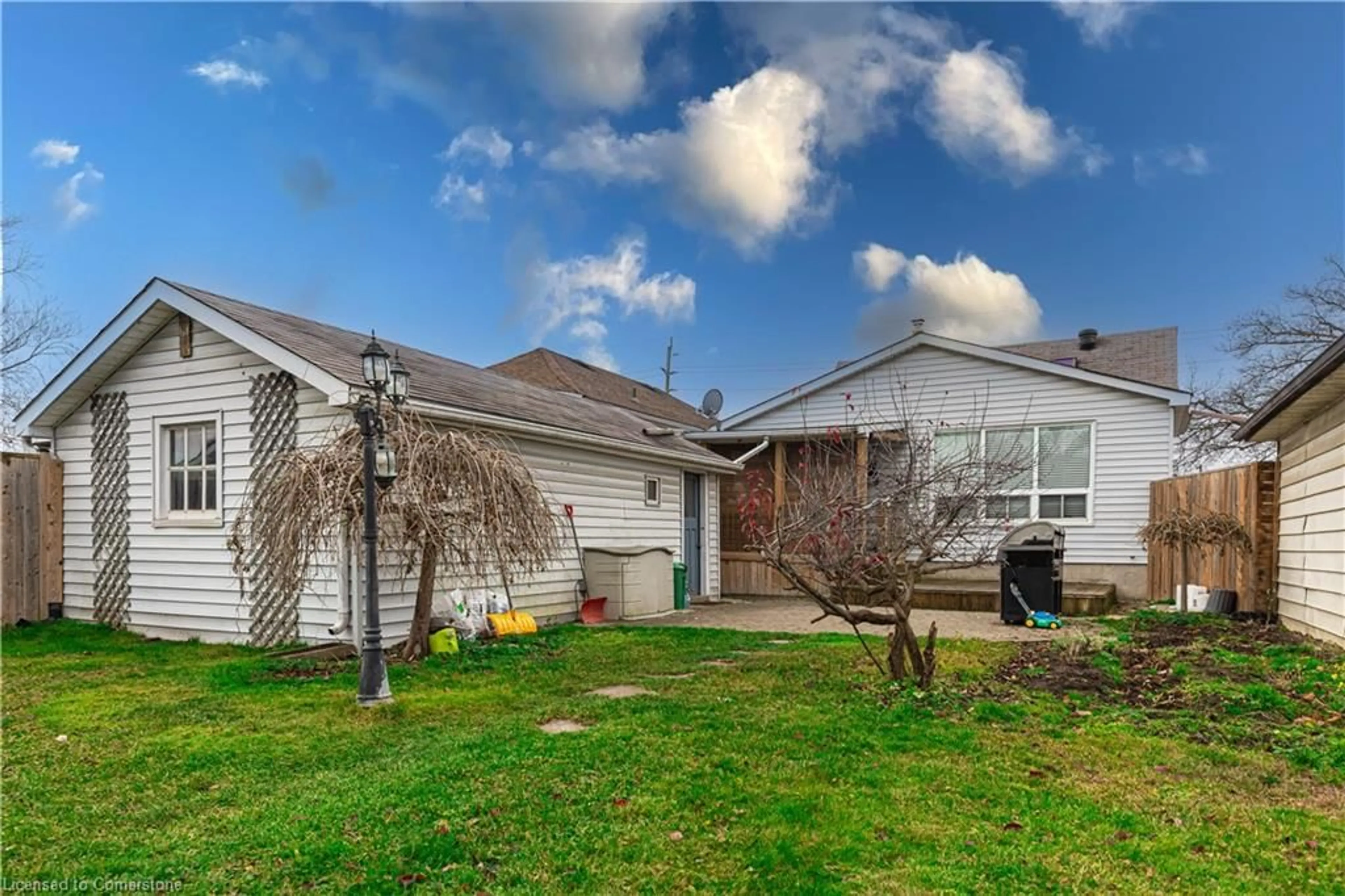 A pic from exterior of the house or condo, the fenced backyard for 448 Third St, London Ontario N5W 4W6