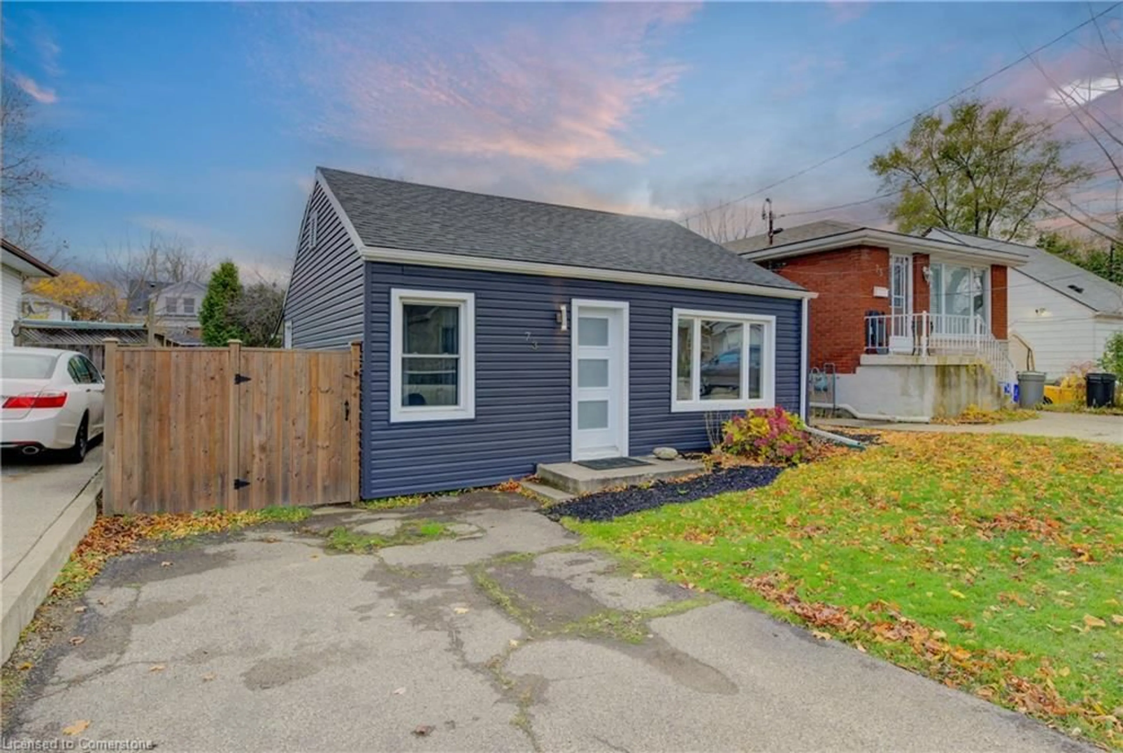 Frontside or backside of a home, the fenced backyard for 73 East 33rd St, Hamilton Ontario L8V 3T3