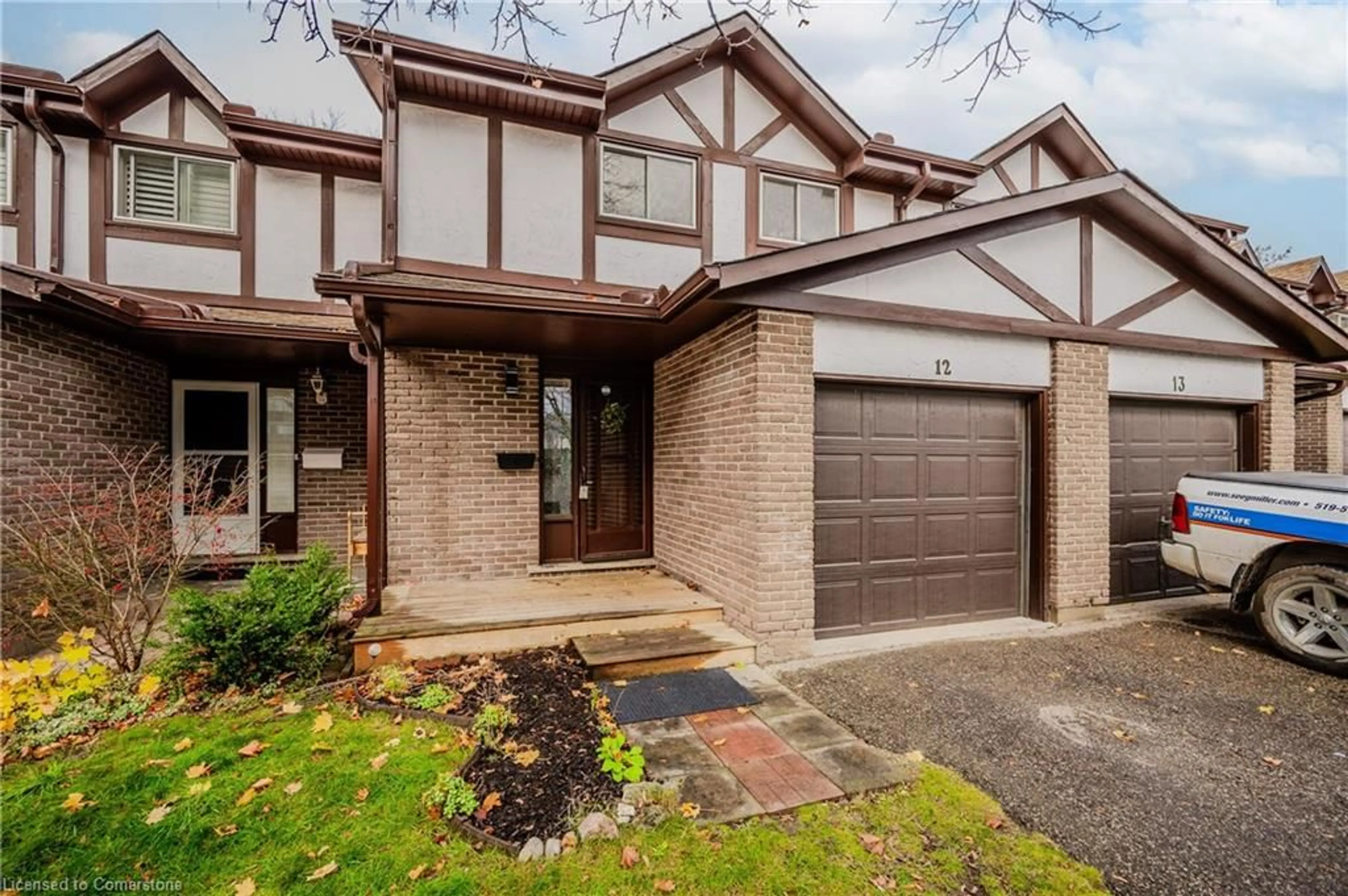 Home with brick exterior material for 46 Cedarwoods Cres #12, Kitchener Ontario N2C 2L7