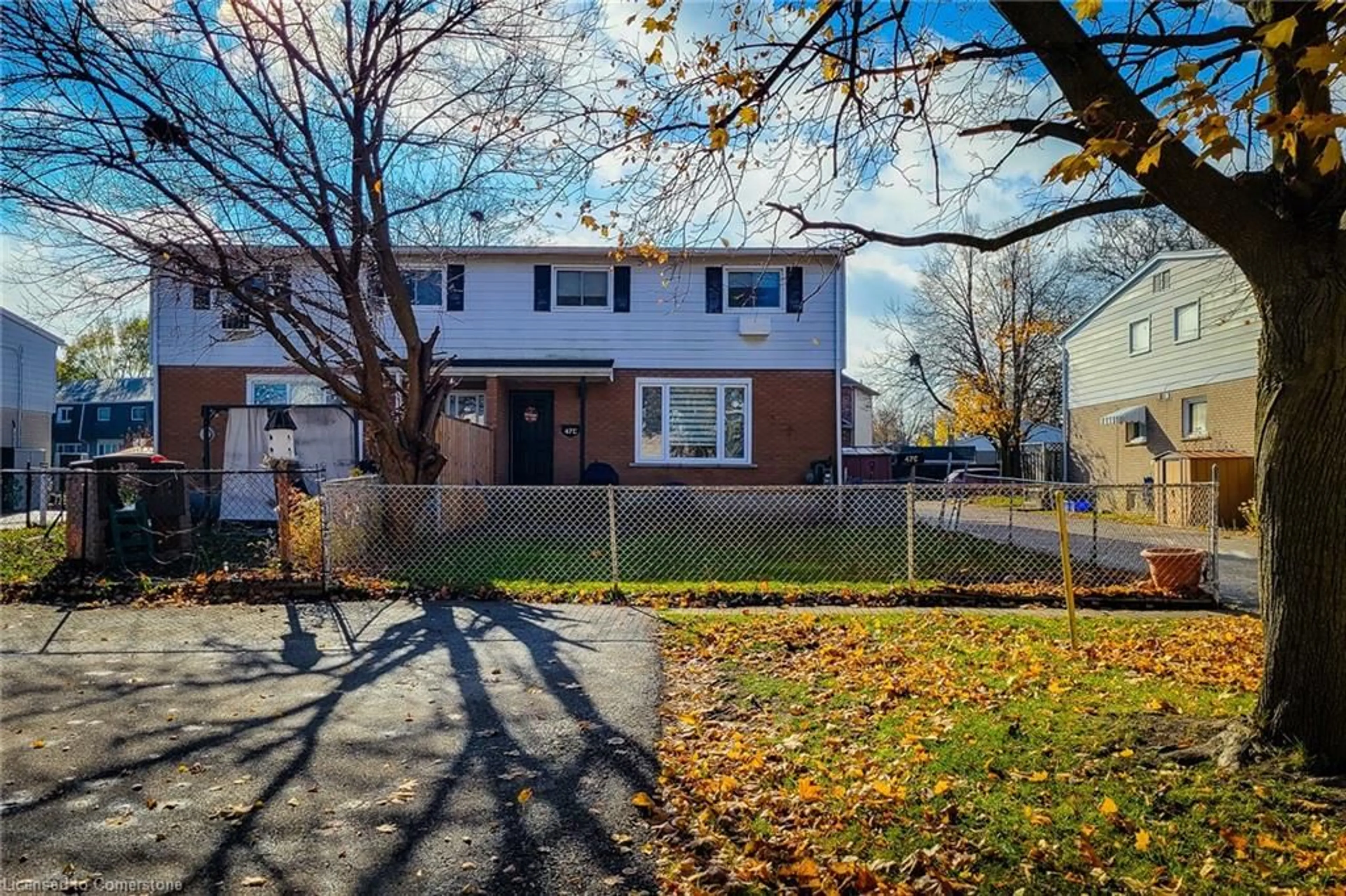 A pic from exterior of the house or condo, the fenced backyard for 47 Metcalfe Cres #C, Brantford Ontario N3R 2L7